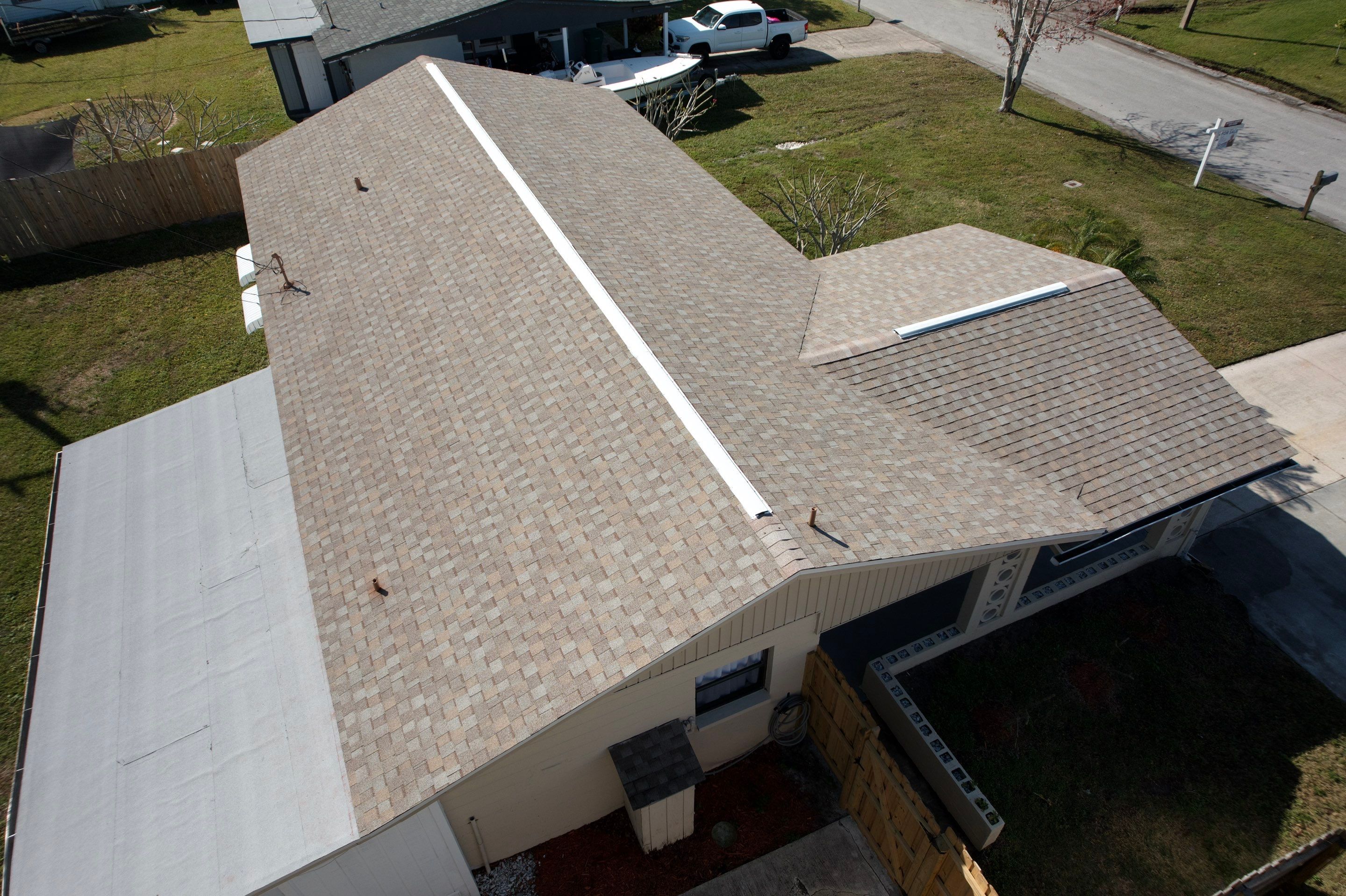 Complete Asphalt Shingle and Flat Roof Replacement in Merritt Island by Wiedmann Construction & Roofing