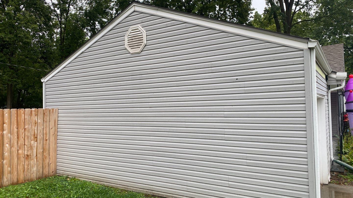 A whole new look for this Gladstone Home  by EEC  Windows, Siding & Roofing 