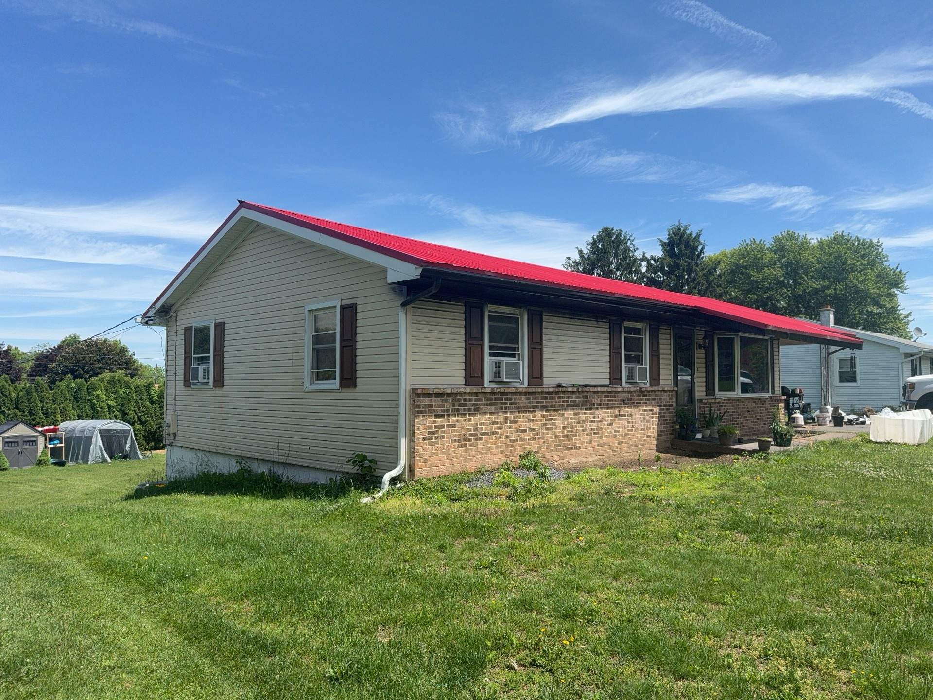 Red ABM Panel Metal Roofing Installation on Elizabethville Ranch Home by Esh Builders