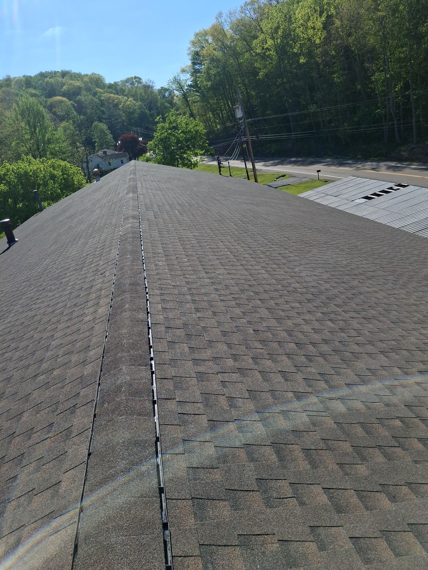 Commercial Roofing Installation using GAF Timberline HDZ Barkwood by Rainstoppers Roofing
