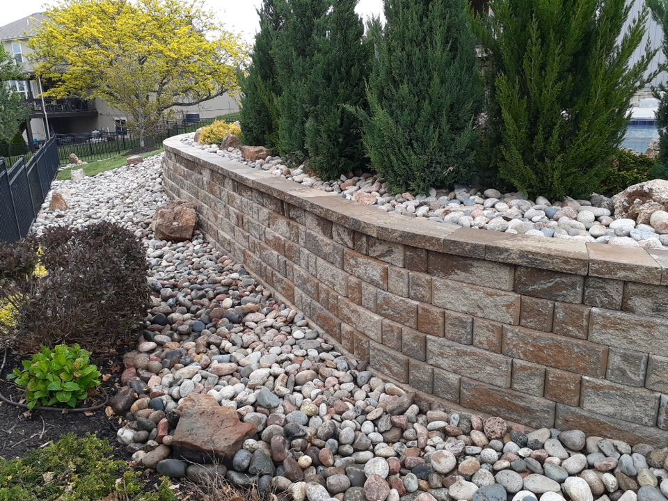 Pool Retaining Wall by LAND ESCAPES LLC