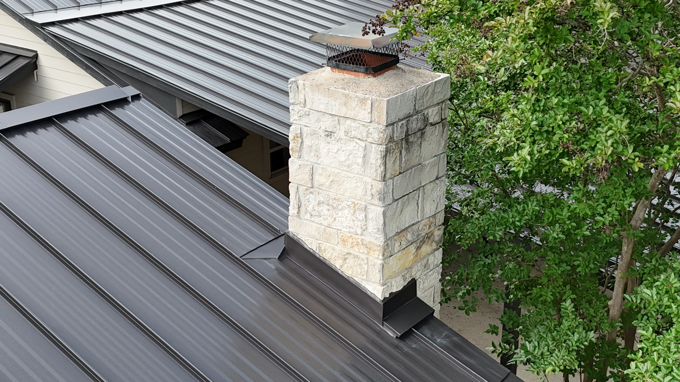 Dark Bronze Fully Striated panel by Wimberley Roofing