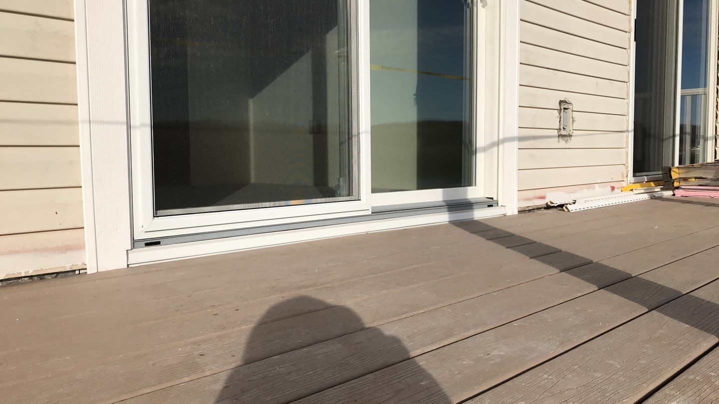 Deck Refurbush and Door Replacement using Trex Decking and Railing. Polaris Patio Doors by Secure Construction Company Inc