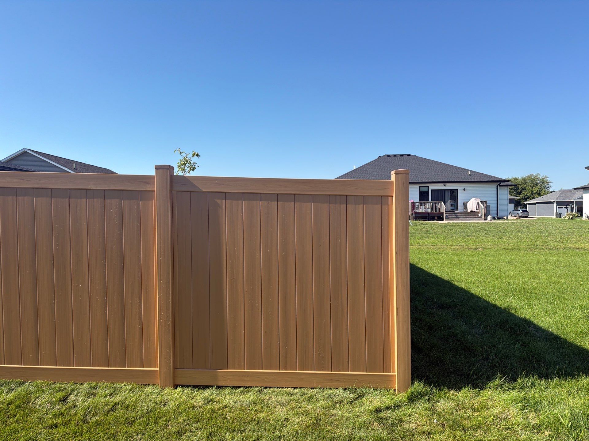 Residential Cypress Vinyl Privacy Fence Installation in Cedar Falls by Perfect Picket Fence and Stain
