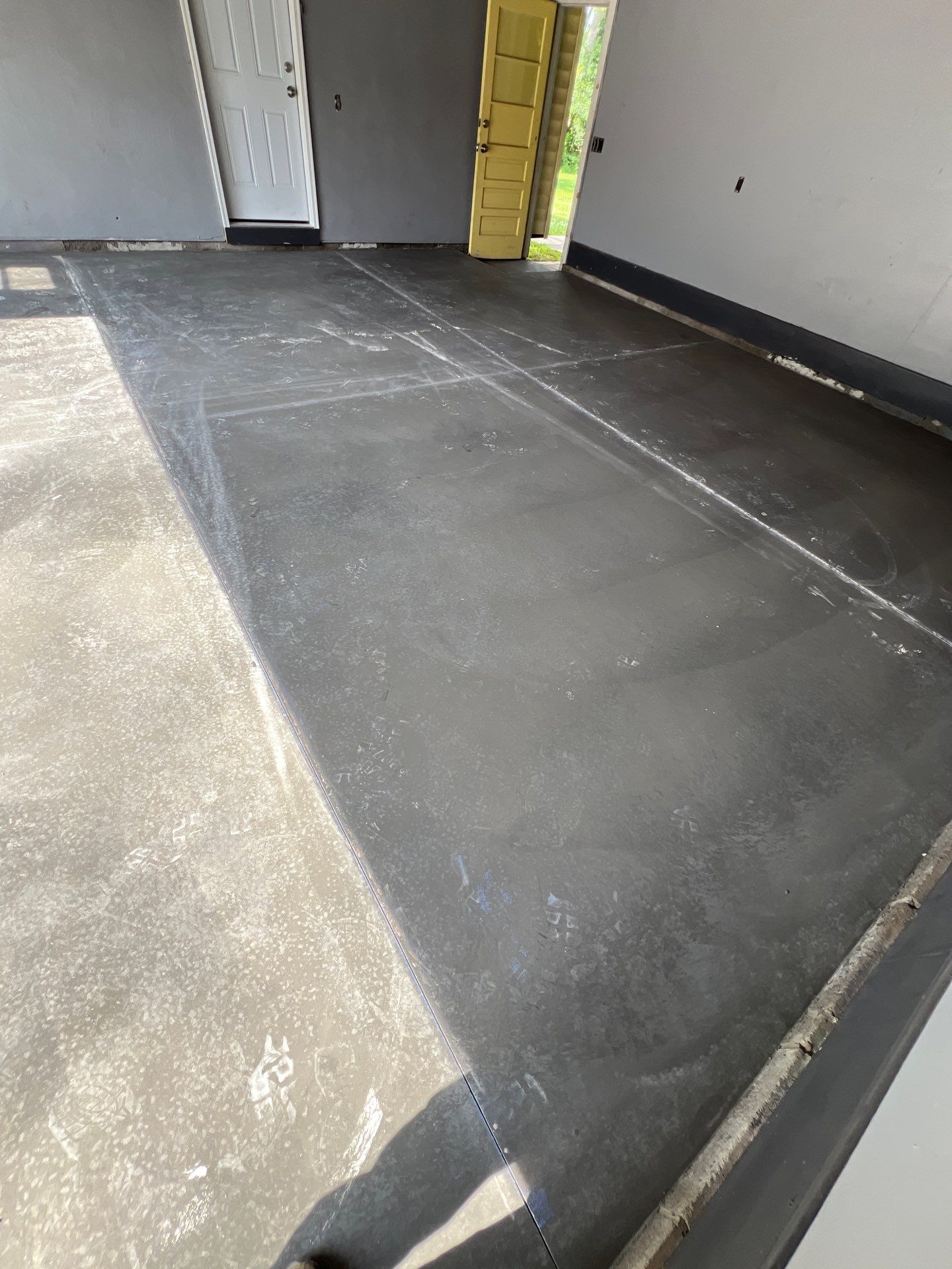 Concrete garage floor replacement and epoxy coating installed by NG Masonry & Construction LLC