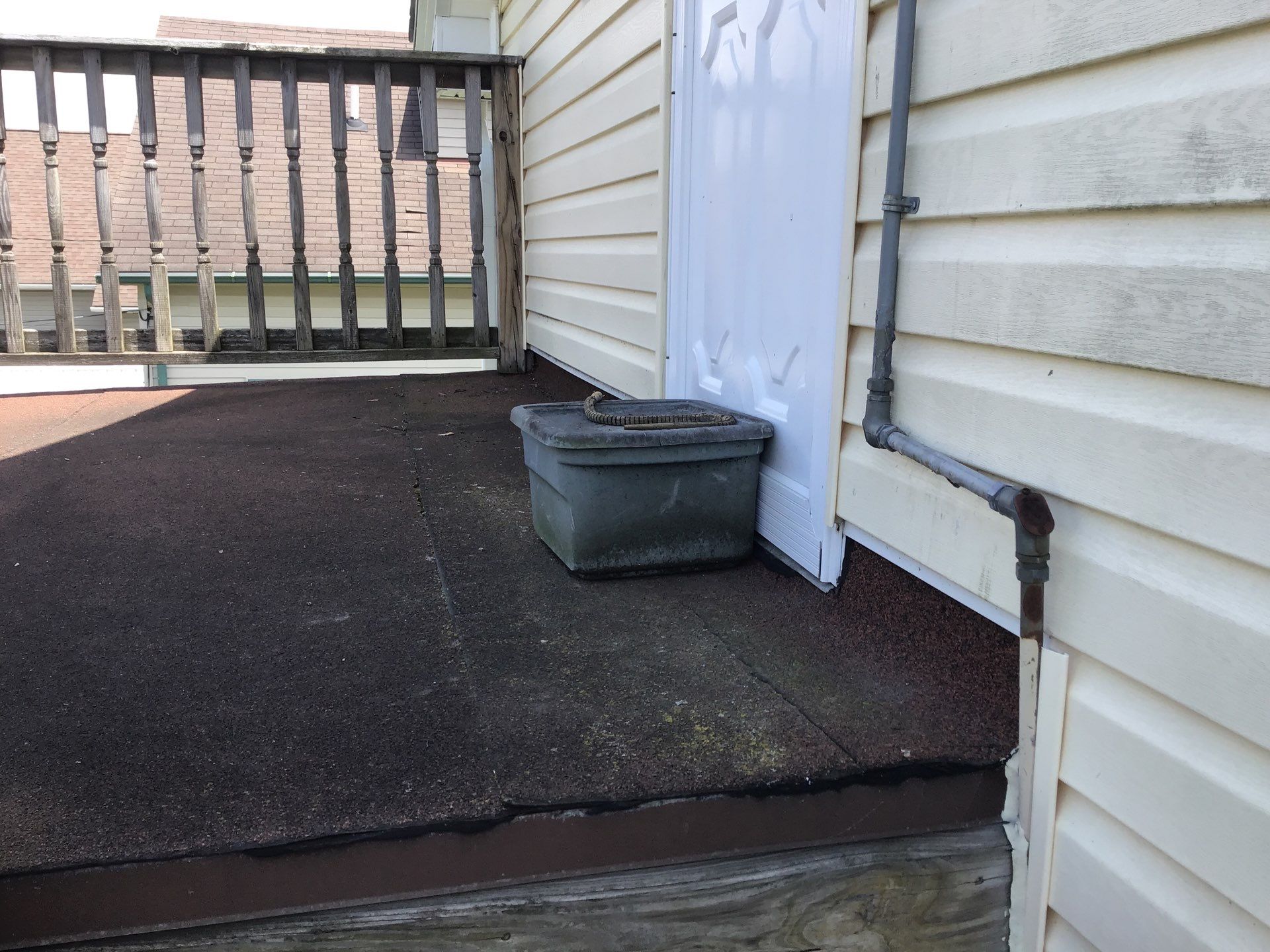 Rebuild balcony flat roofing TREX decking stairway and Railings in Wyandotte, MI by Northwest Construction 