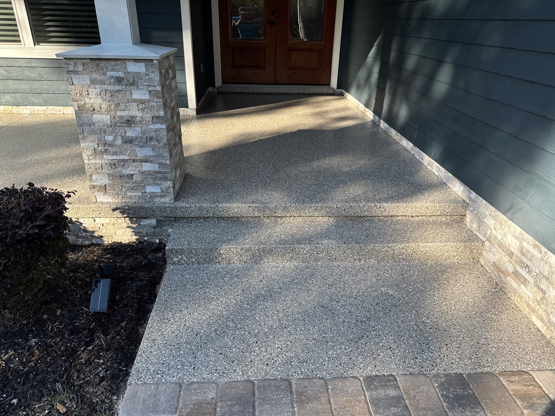 Front and Back Porches in Chiefland, FL in Pebble Beach by Cross Creek Concrete Coatings