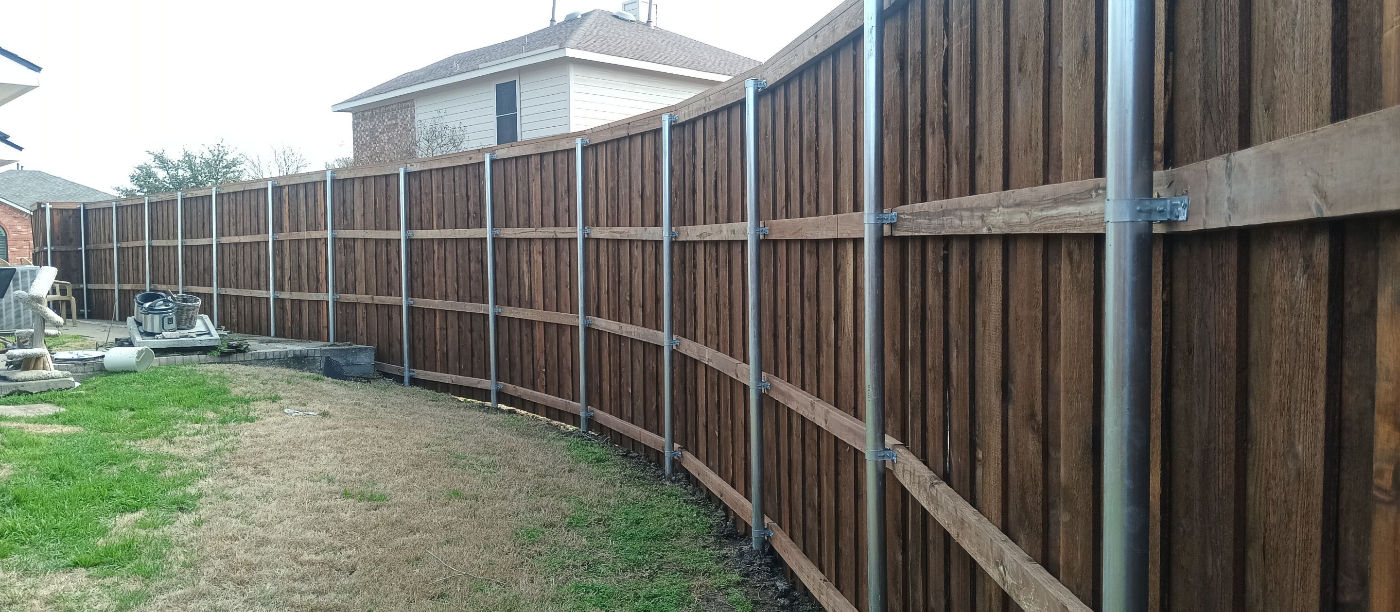 Pre-Stained 8' Board on Board cedar w/ trim and cap  by Grizzly Fence And Patio