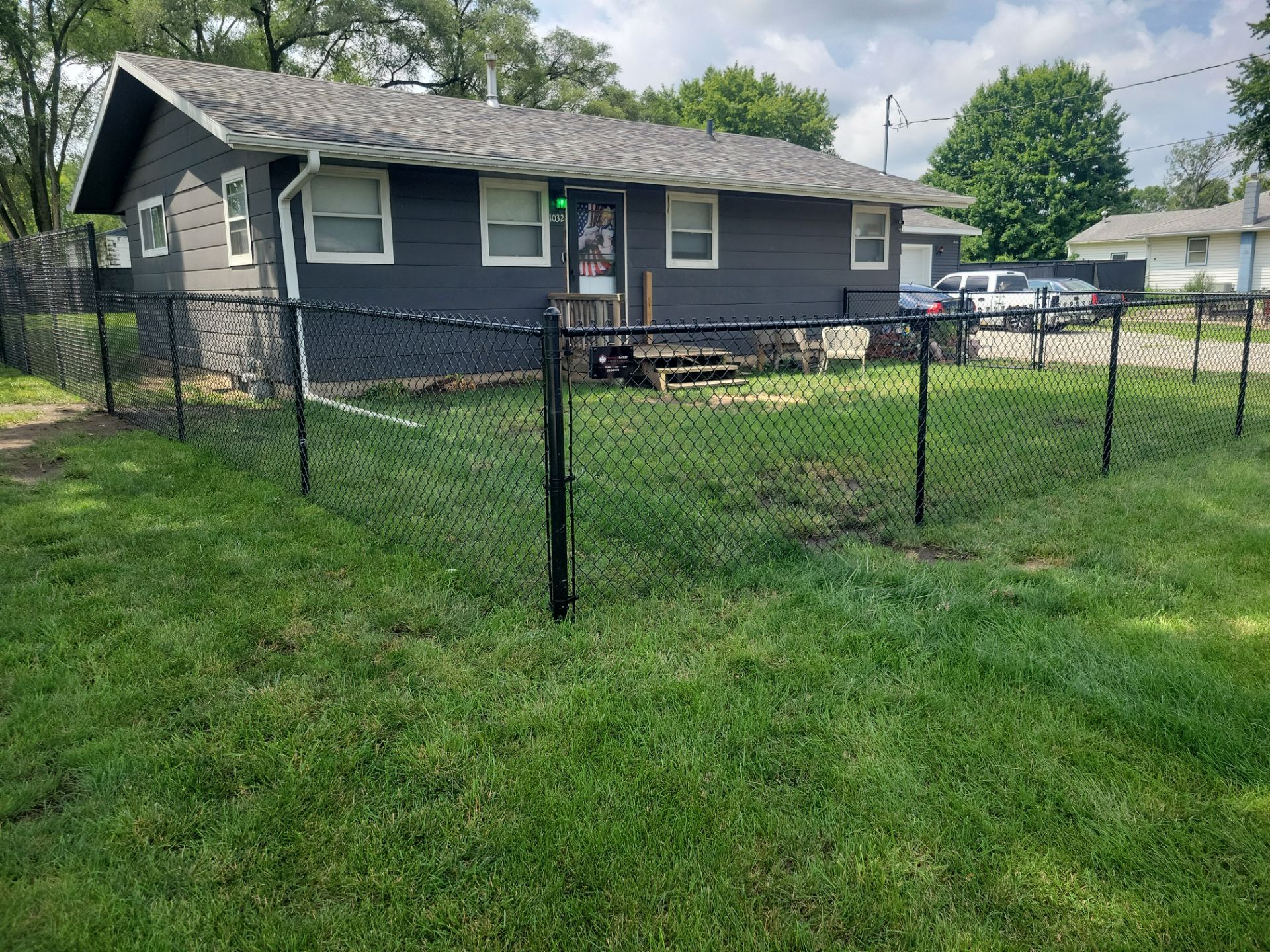 Black Chain Link Perimeter Fence Installation in Waterloo by Perfect Picket Fence and Stain