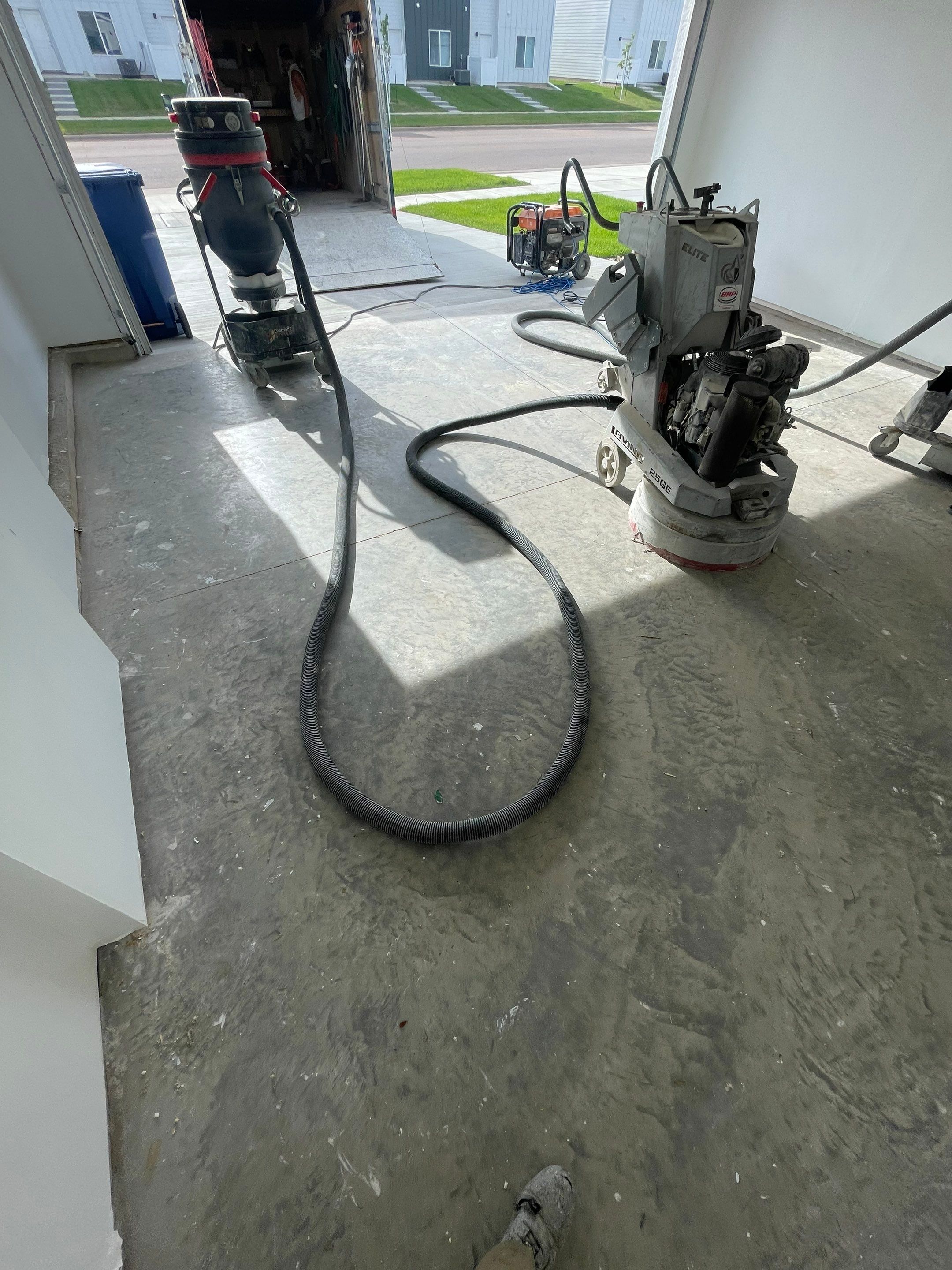 Sioux Falls Garage Floor Transformation with Cabin Fever Decorative Chips by Select Painting, Coatings & Garage Cabinets