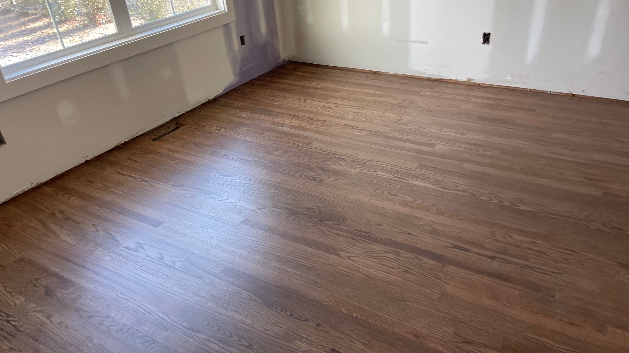 Remodeled Home with new tile floors, Showers and Refinished Oak Floors with stain and Waterbased Finish by Footprints Floors of Coastal Carolina