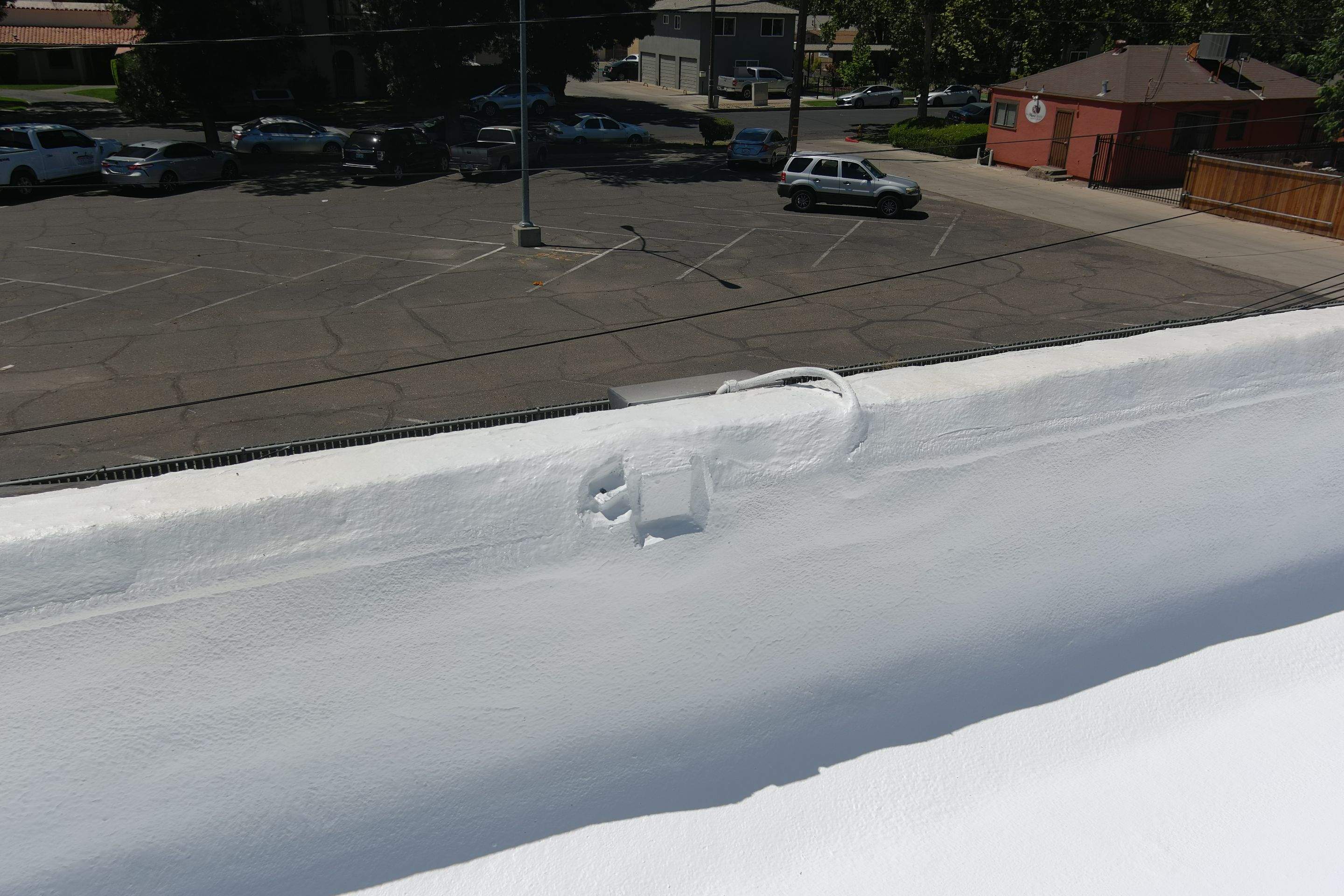 Commercial Roofing Installation using Conklin BenchPly system with PUMA top coat (imbedded fabric system) by Straight Edge Roofing Inc