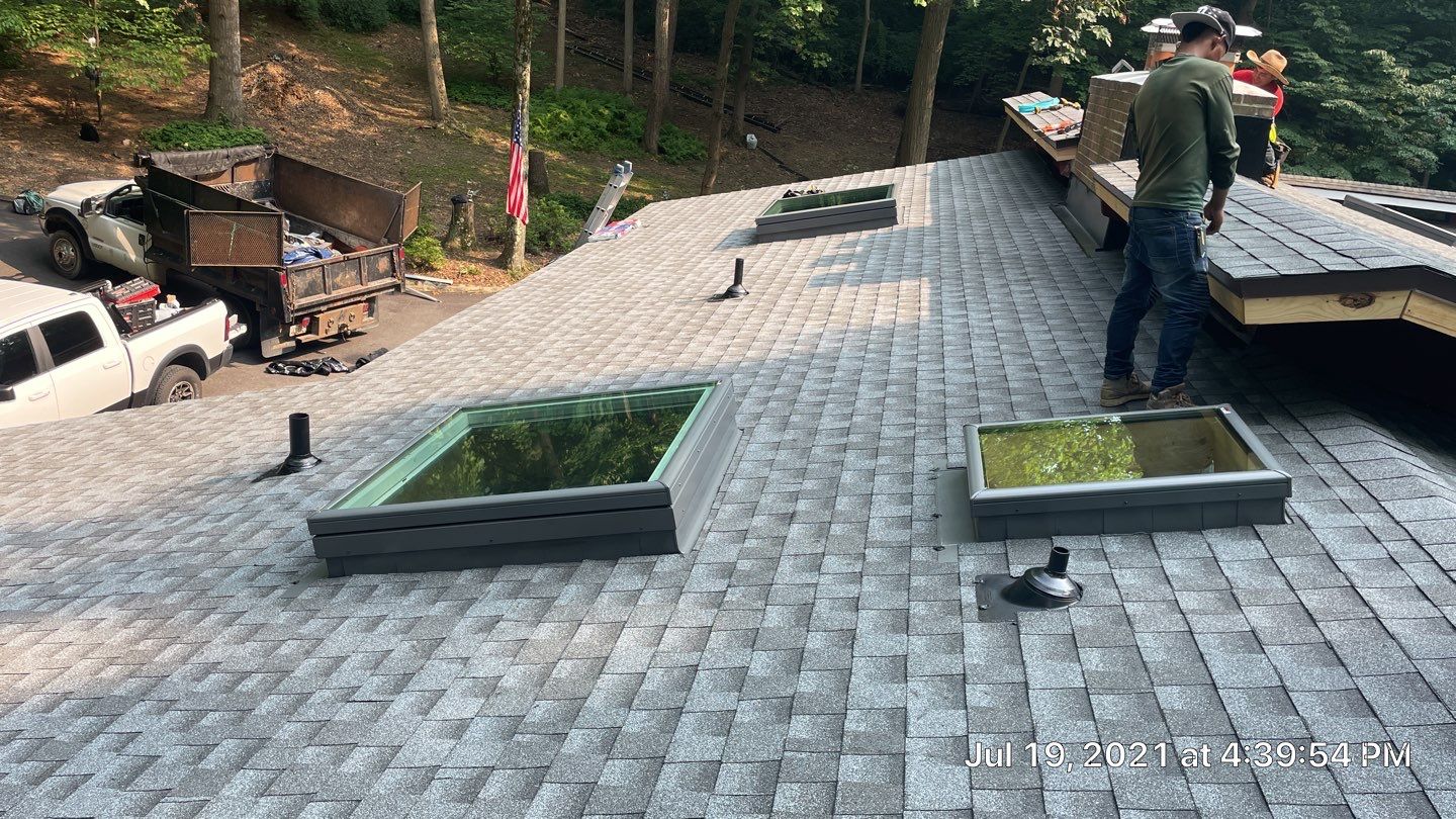 Deckhouse Roof Replacement by American Home Contractors