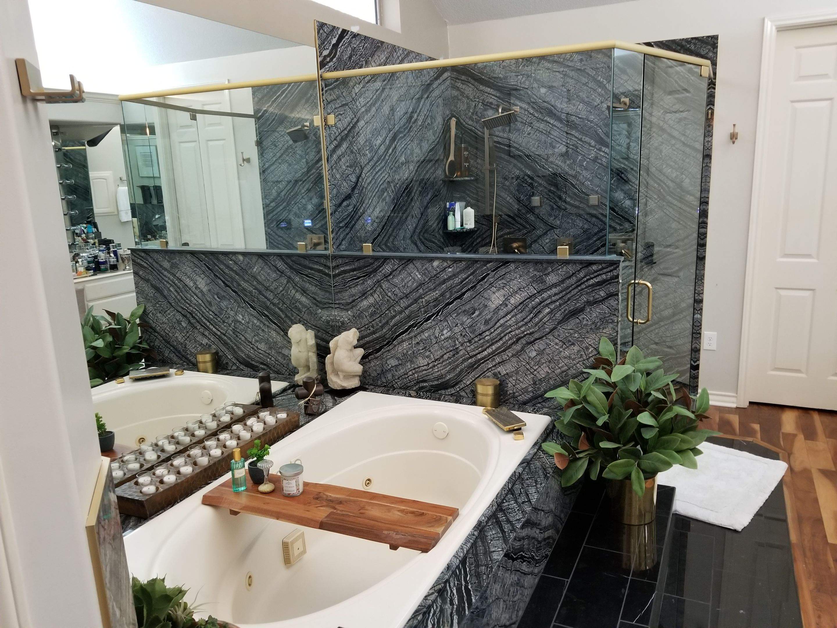 Bookmatched Natural Stone Shower by Legacy Bath and Kitchen 