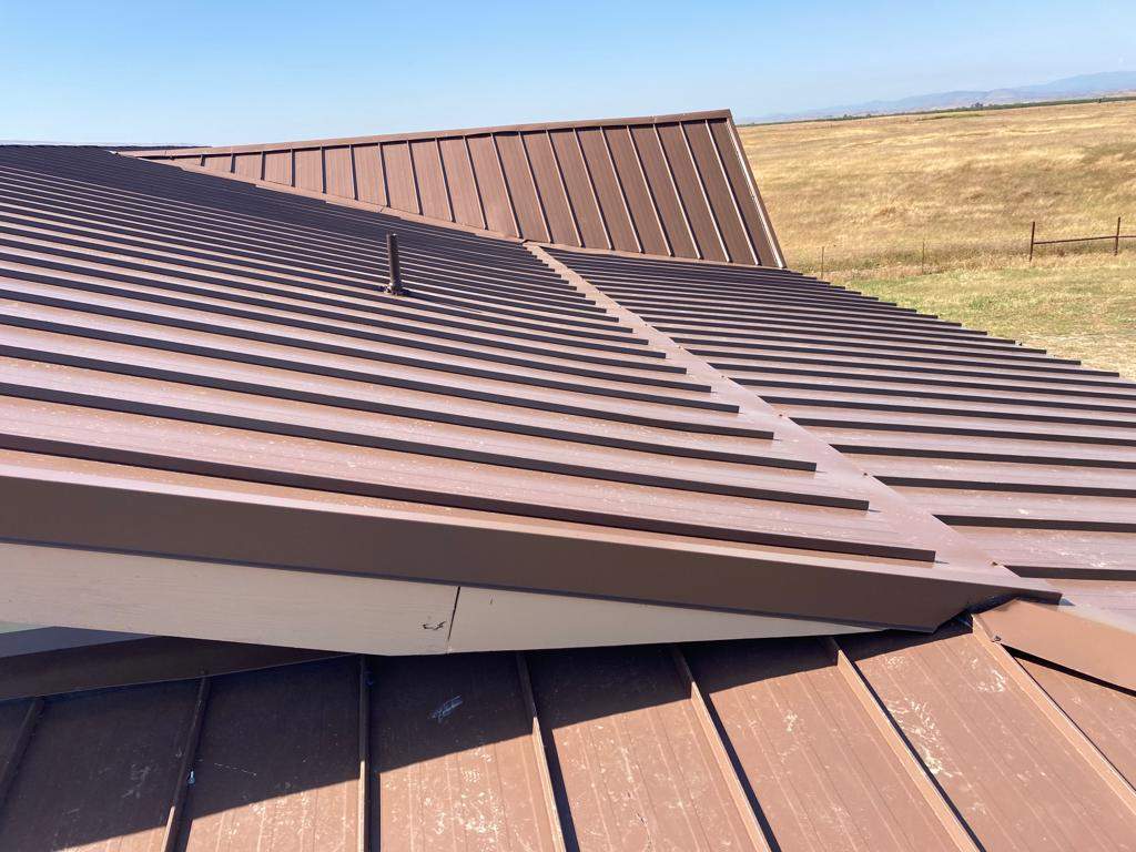 Metal roofing installation using Standing seam metal roofing system by Straight Edge Roofing Inc