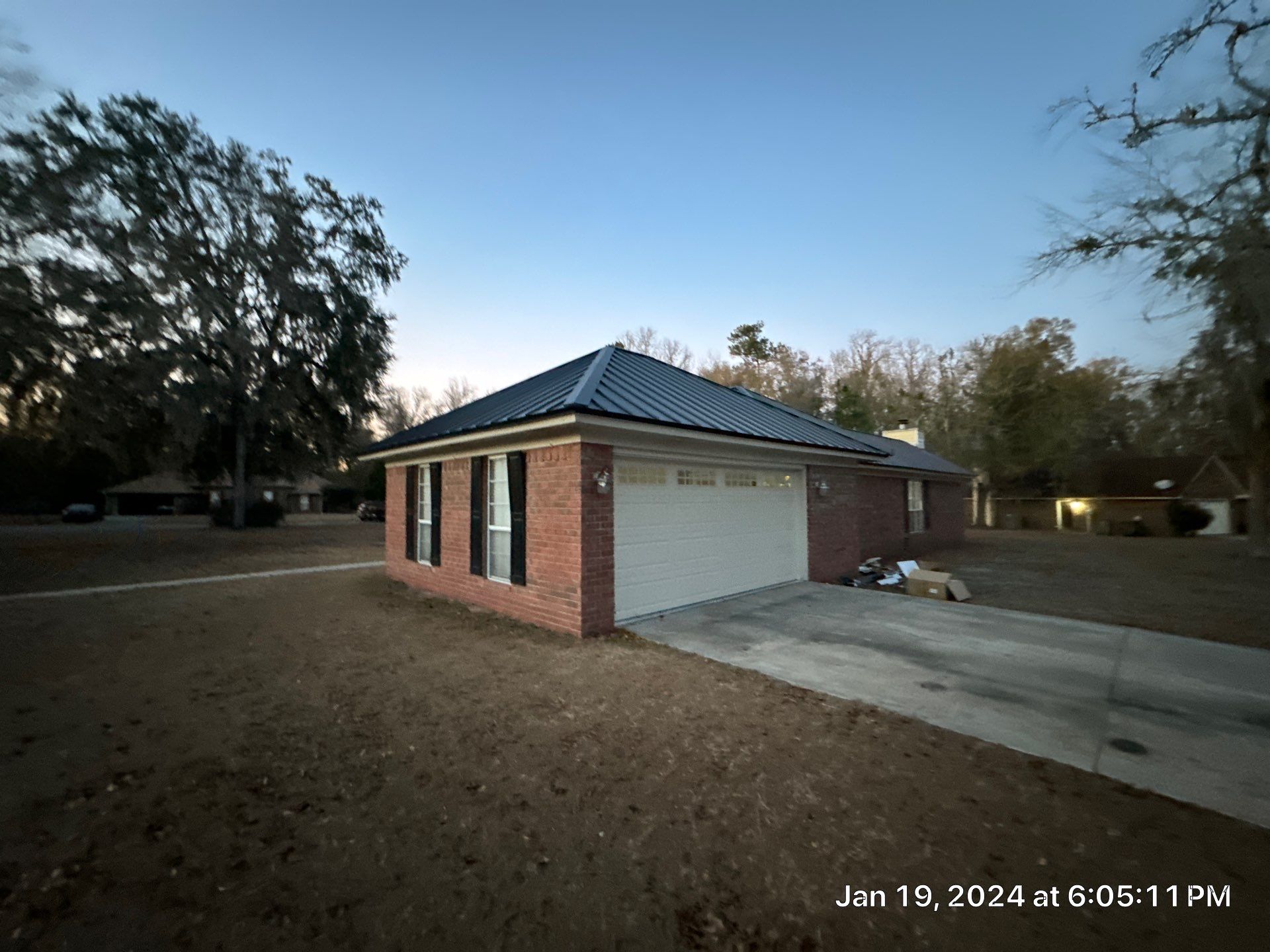 Residential Roofing Installation using Benton 26Ga 1inc Snapcock Metal Roof KYNAR Matte Black by Talya Roofing