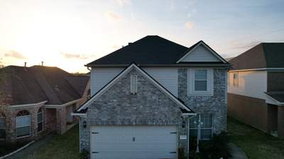 Slate-Gray Roof on Stone-Front Home — Spring, TX