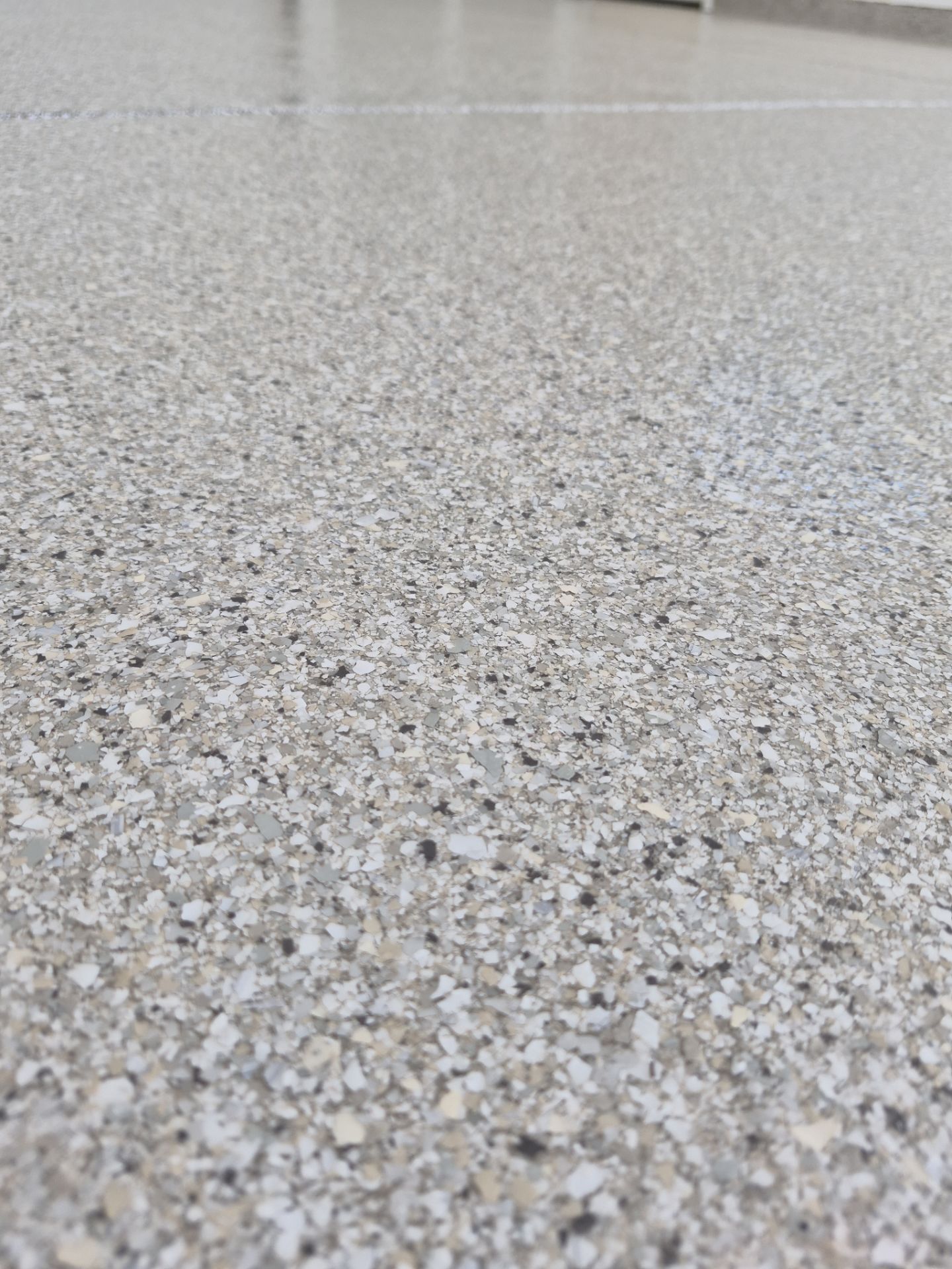 Limestone Hybrid Garage Floor Transformation in Coeur d'Alene by Croc Coatings, LLC