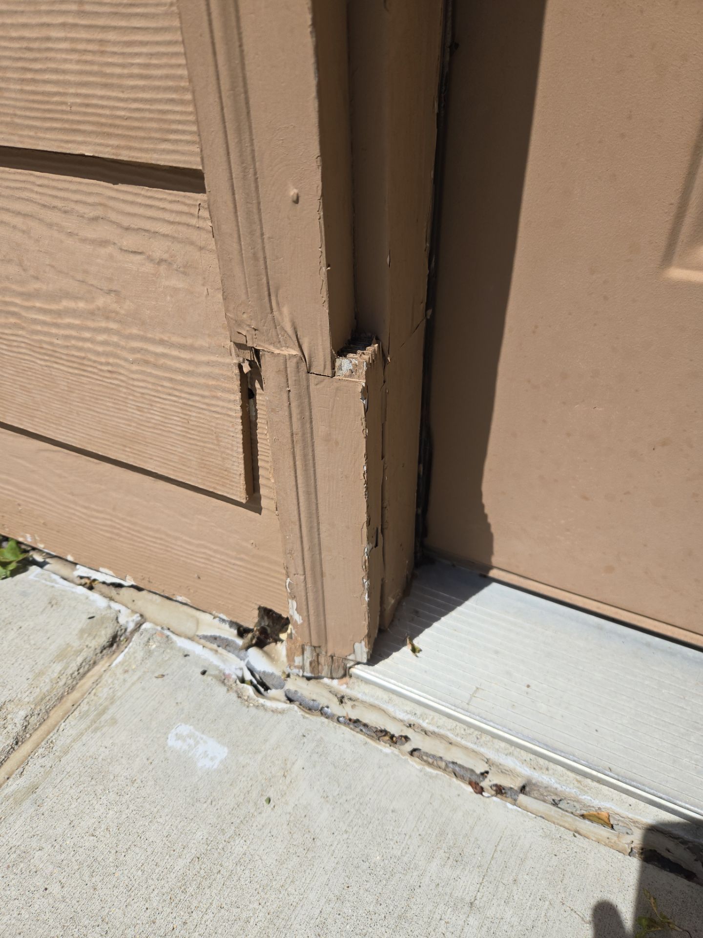 Sioux Falls Residential Exterior Door and Siding Refresh by Select Painting, Coatings & Garage Cabinets