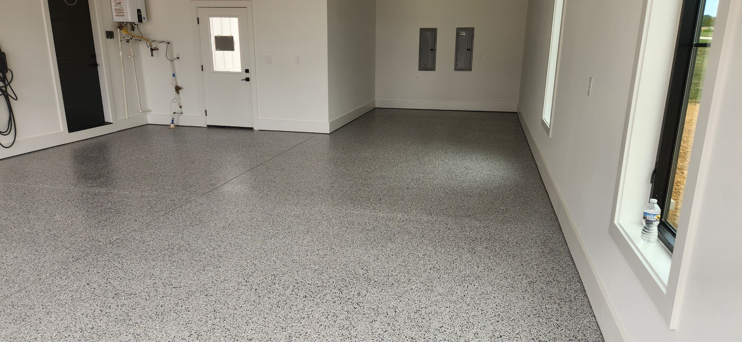 Garage Transformation Using Houndstooth by Elite Floor Solutions