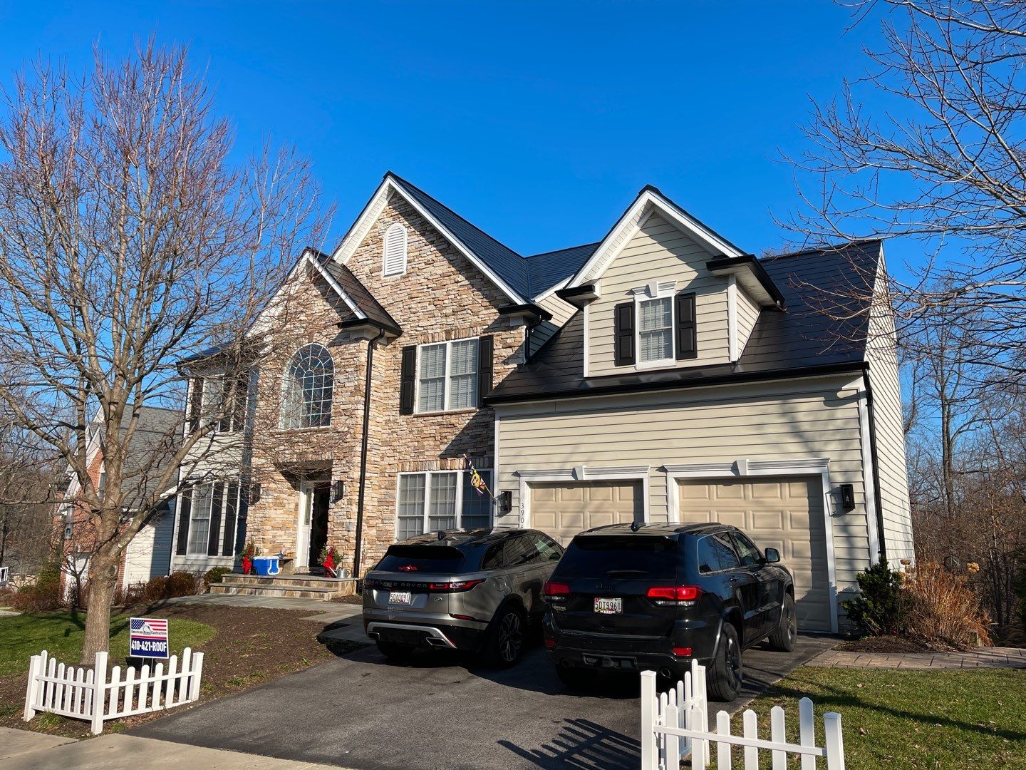 Tesla Solar Roof and Gutter Installation by American Home Contractors