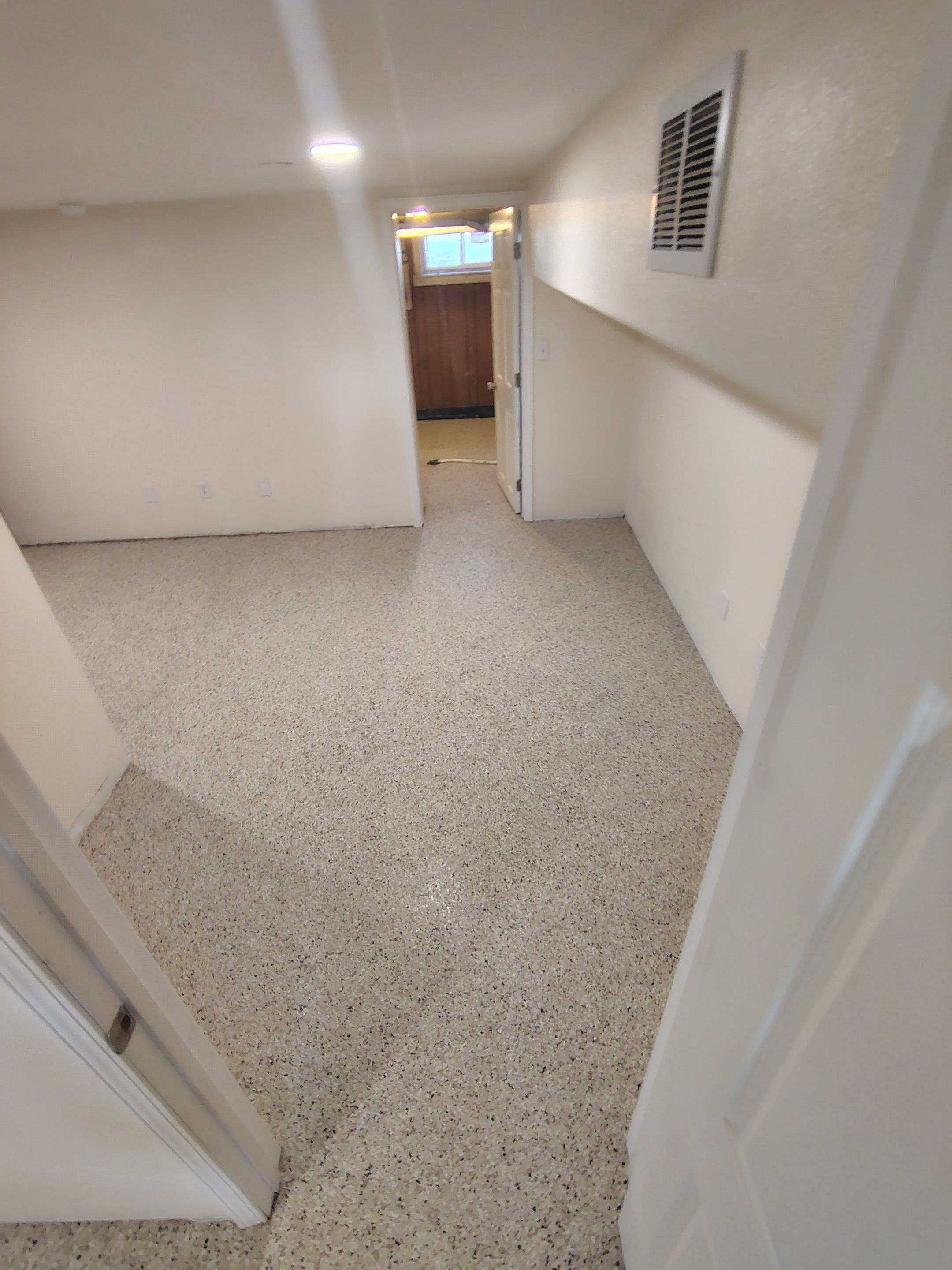 Comprehensive Basement Concrete Floor Coating and Crack Repair in Sioux Falls by Select Painting, Coatings & Garage Cabinets