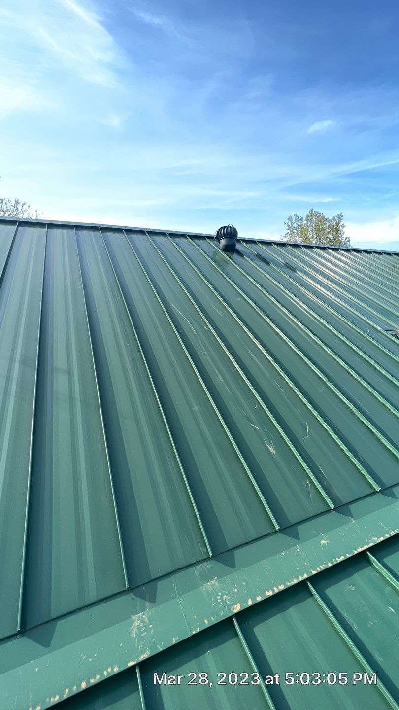 Shingle to Standing Seam Metal Roof by Springtree Restoration 