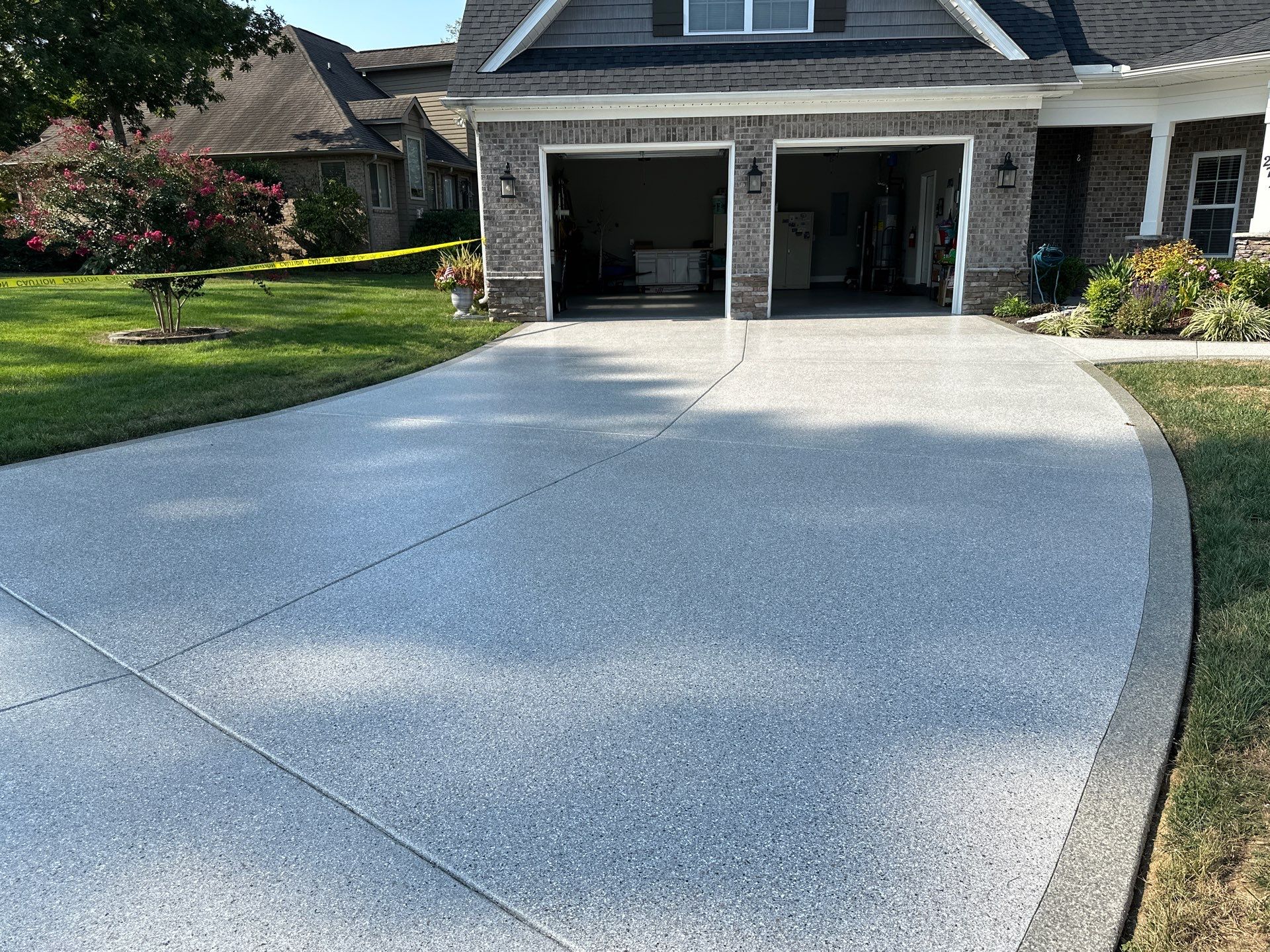 Driveway Improvement Using Claystone With Trail Mix Border! by Elite Floor Solutions