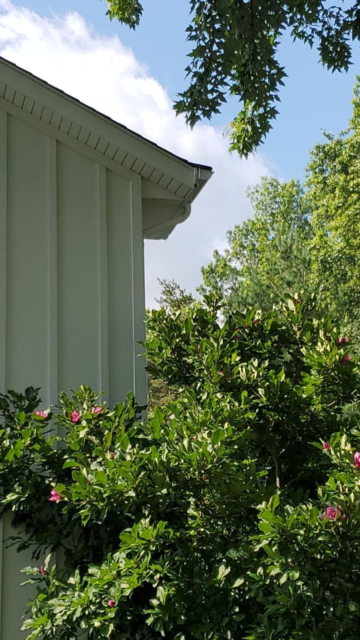 James Hardie Siding  using James Hardie Board and Batten, White by Absolute Roofing and Construction
