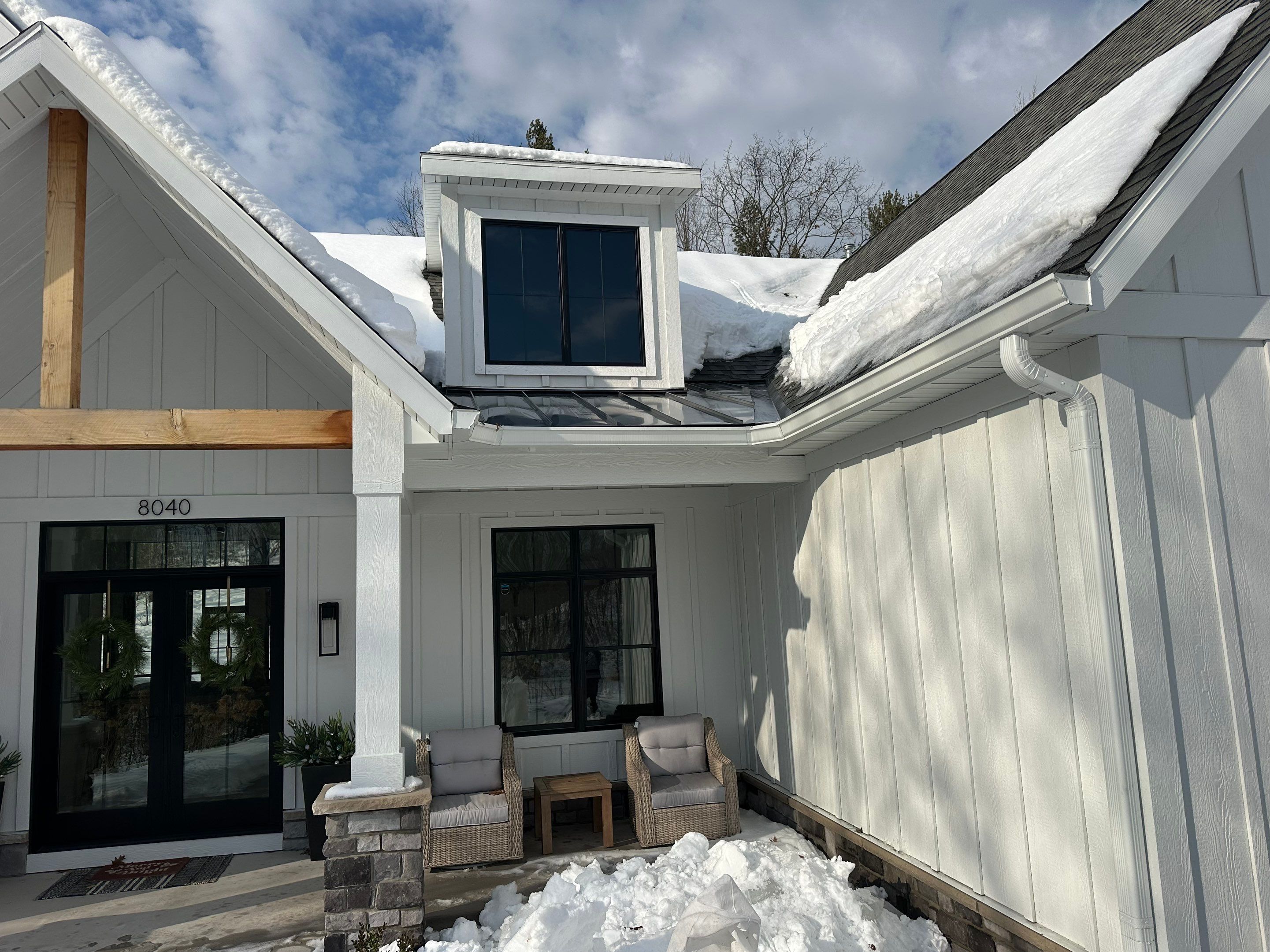 Residential Ice Dam Removal in Traverse City by Rainbow Seamless Systems