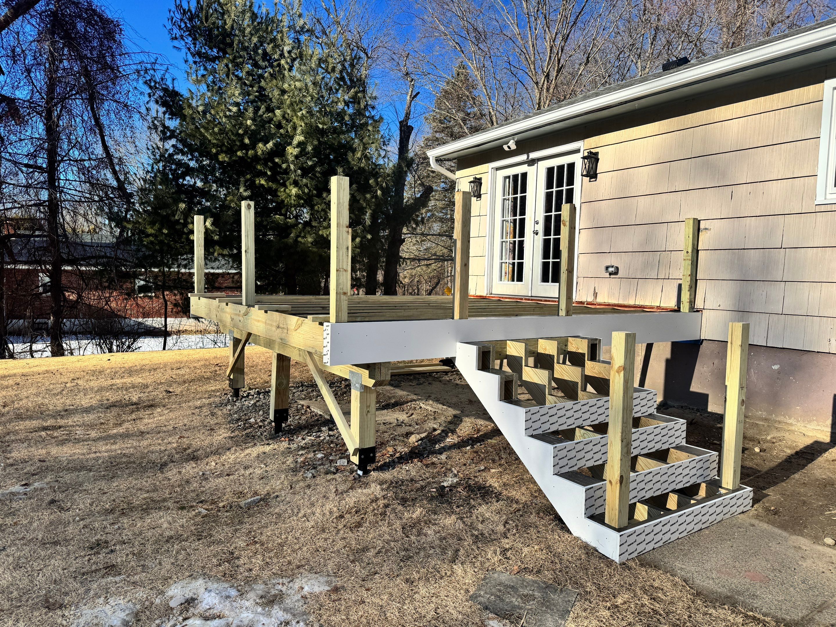 Deck replacement using Trex Lineage Rainier , and Transcend White railing.  by DiGiorgi Roofing and Siding Inc