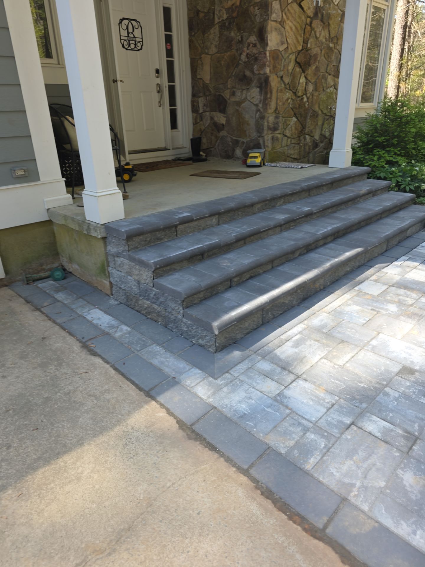 Pittsboro Outdoor Living Transformation – Retaining Wall, Paver Patio & Elevated Deck by Elite Remodeling and Design LLC