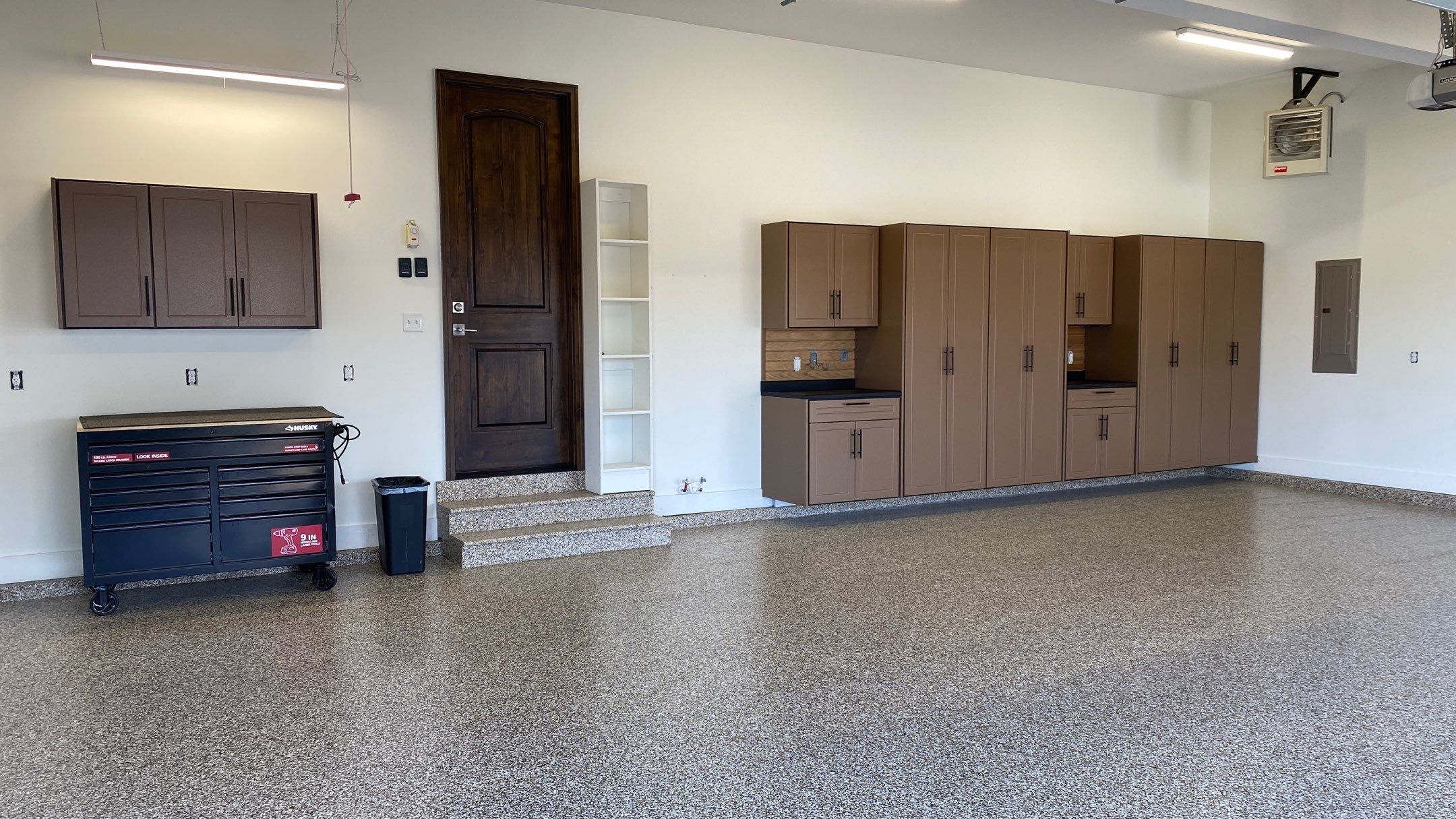 Kenny & Debbie transformed their garage with a Banner Garage Floor and cabinets by Banner Garage