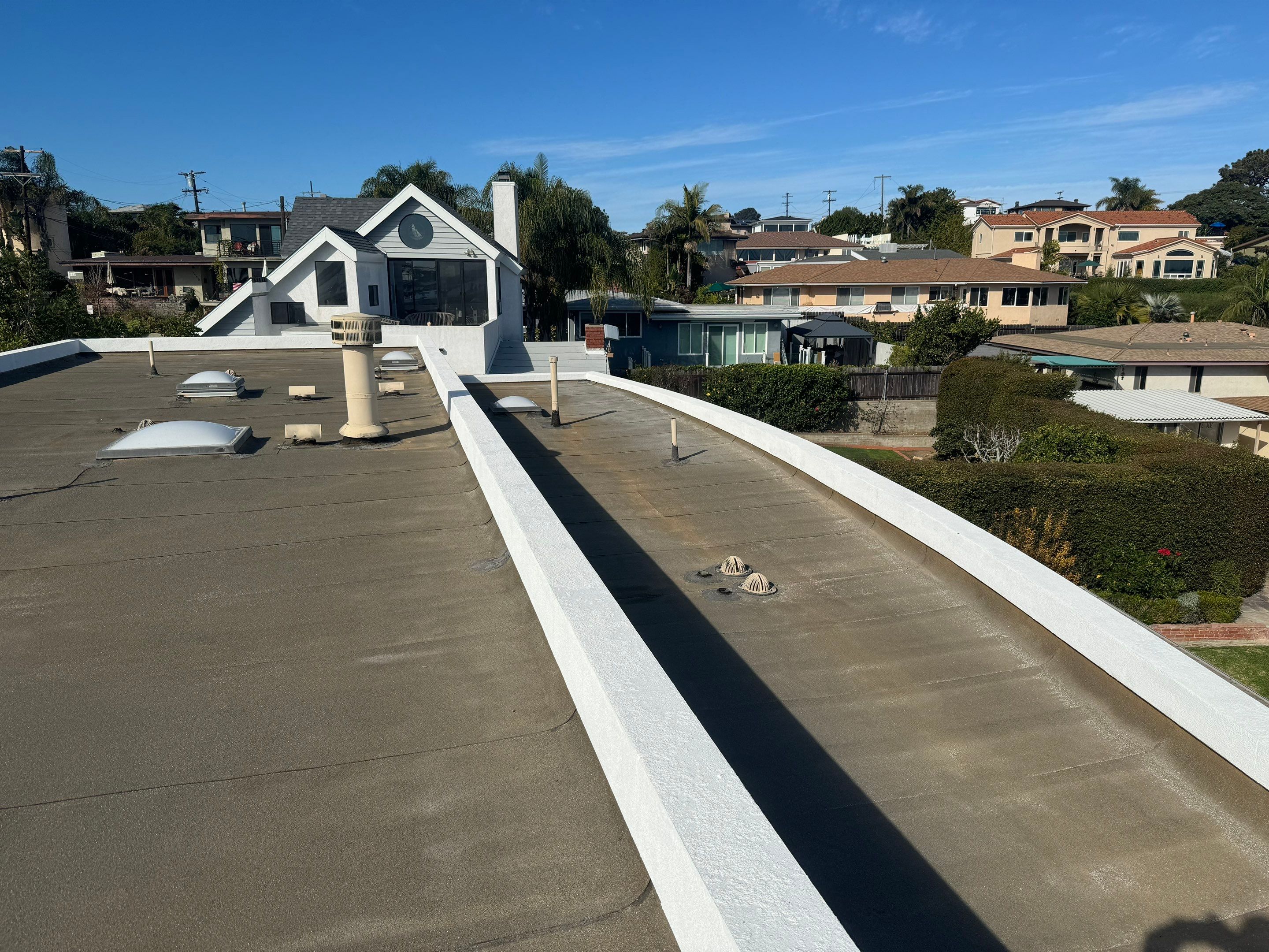 Point Loma Flat Roof Replacement – Johns Manville Bright White Torch-Applied Roofing System by Zenith Roofing Services 