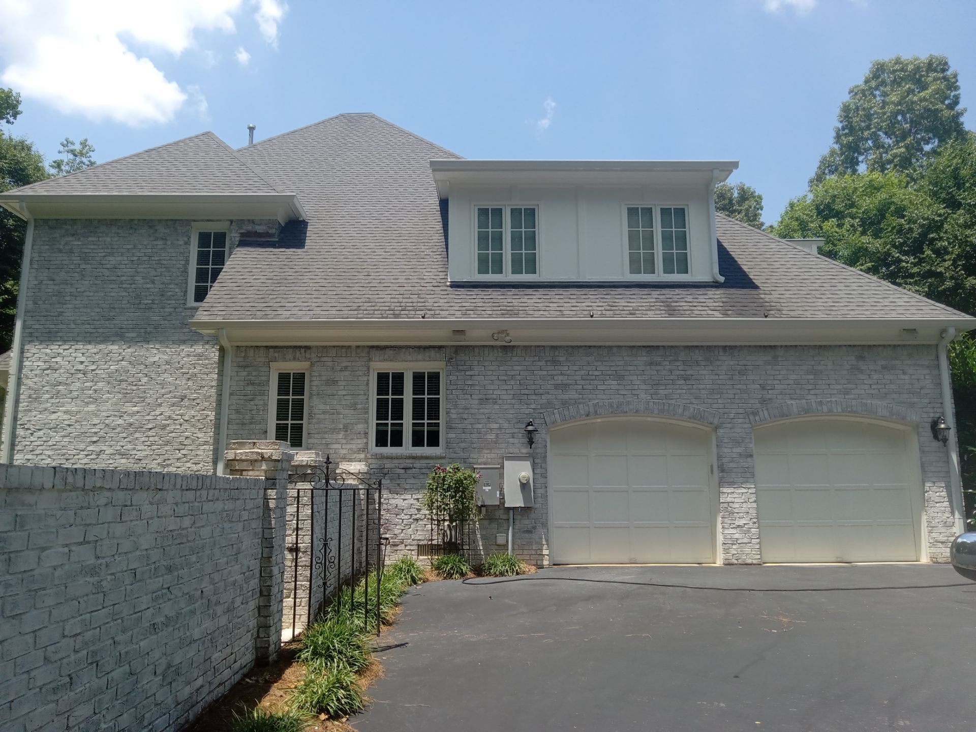 pressure washing exterior home surfaces including brickwork driveway and possibly the roof