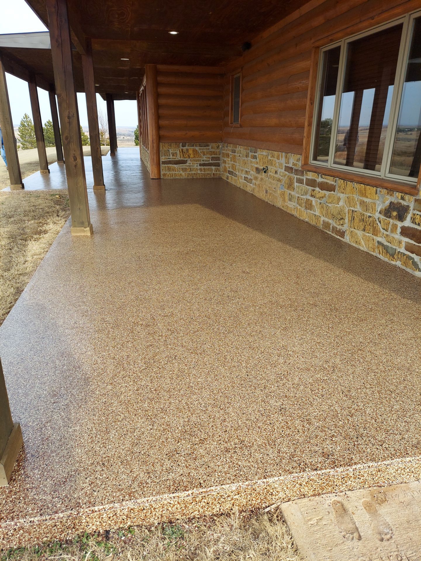Patio Coating Installation with Chestnut by Copperhead Coatings