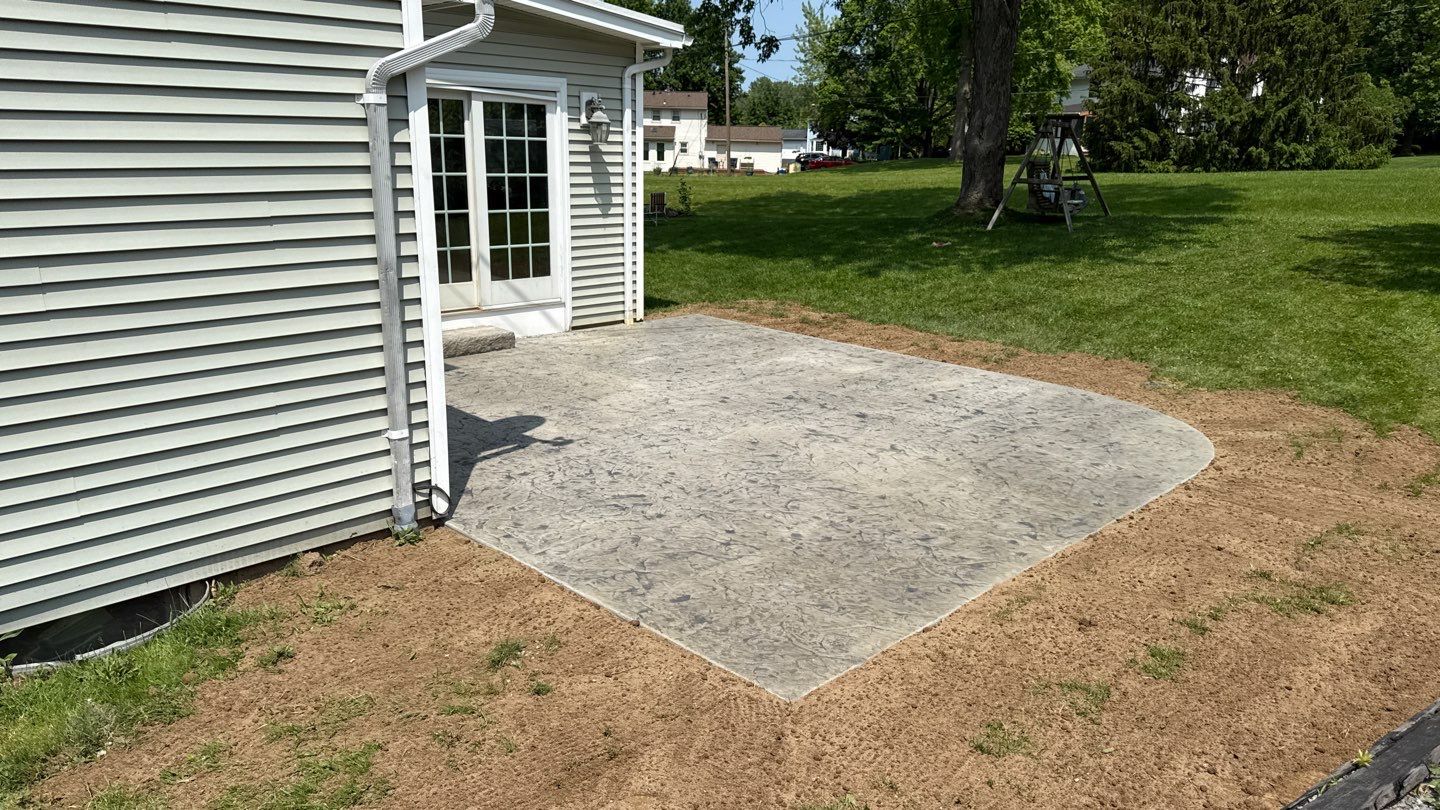 Oxford slate stamped patio  by NG Masonry & Construction LLC