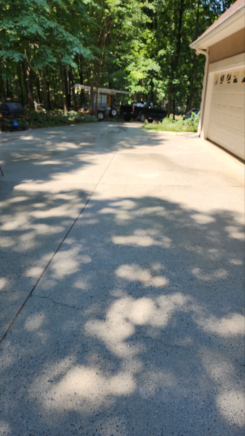 Driveway Clean using cleaner by Power Wash Masters LLC