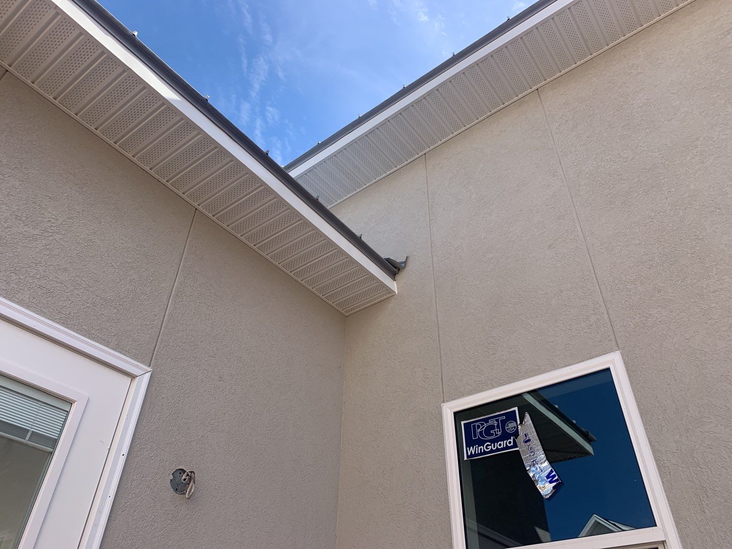 Soffit and Fascia Installation using White Vinyl Soffit in Pensacola FL by Gutter Professors