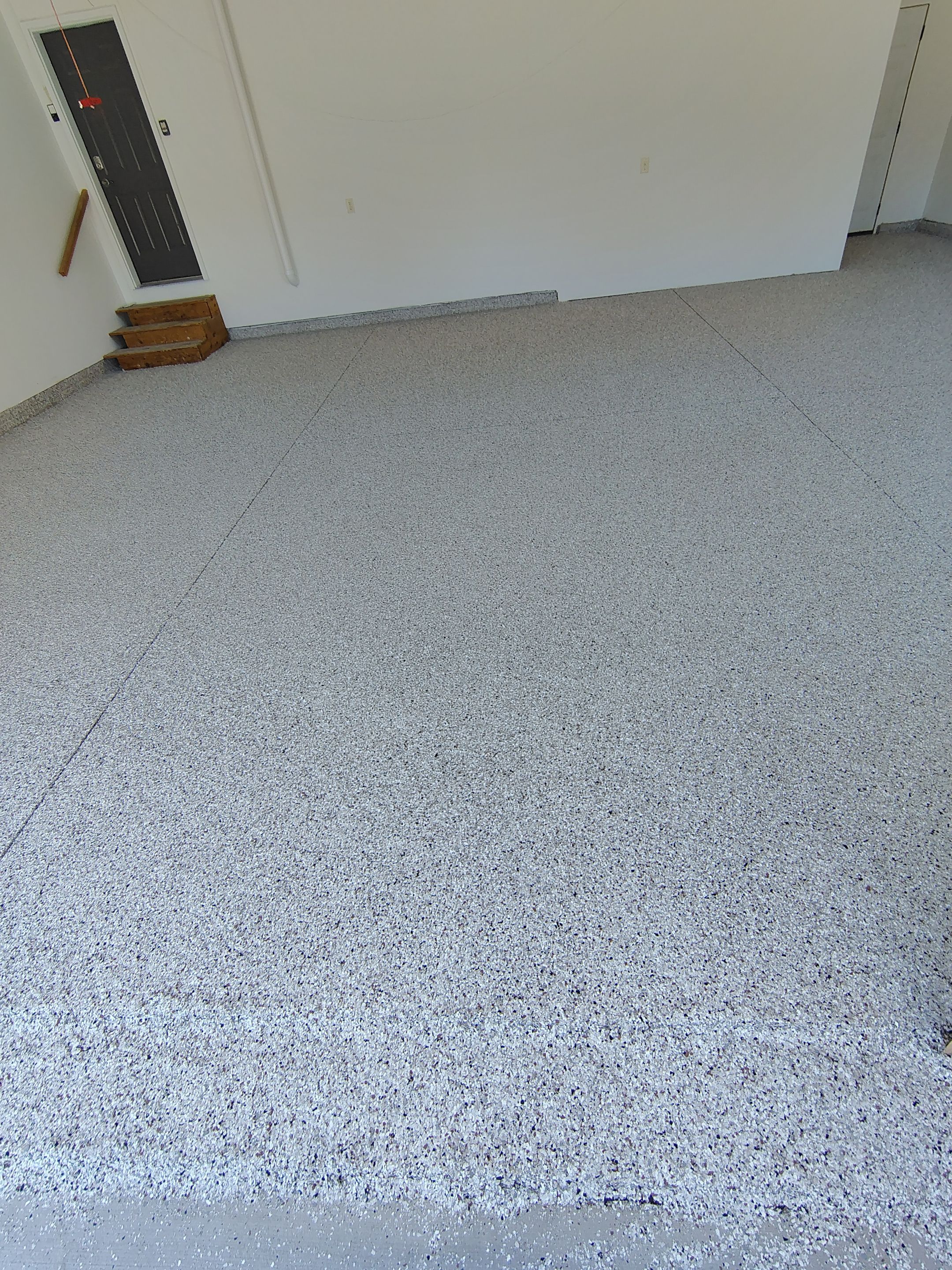Custom Grey Speckled Epoxy Floor Coating for Sioux Falls Garage by Select Painting, Coatings & Garage Cabinets