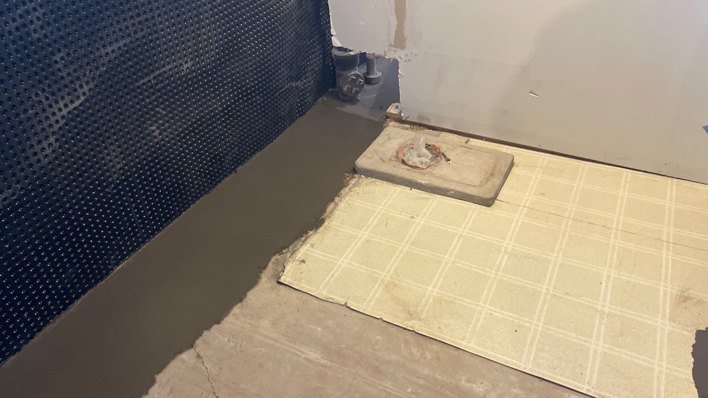 Interior Drain Tile & Buried Discharge in South Minneapolis by Waterproofing Northeast