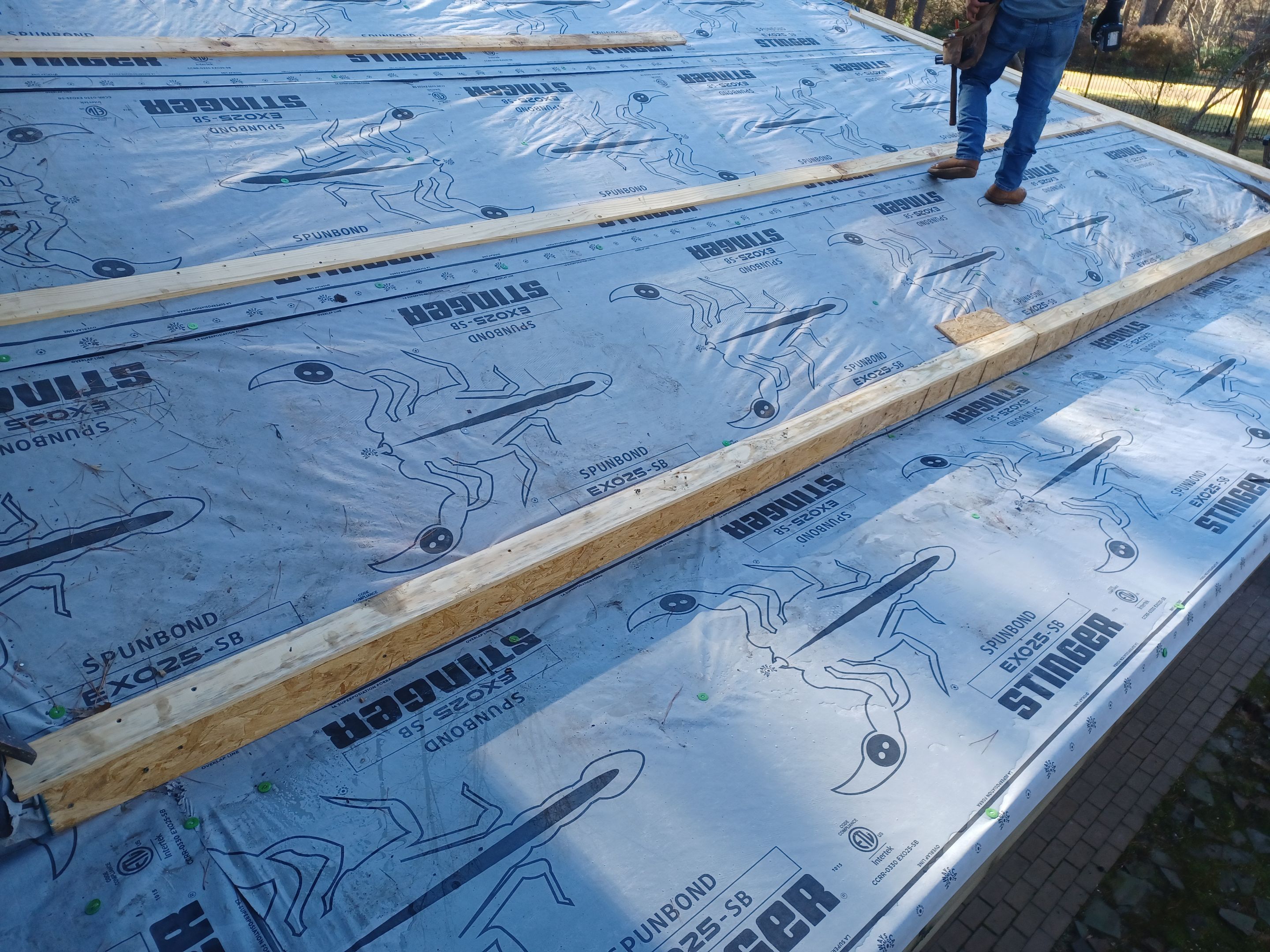 Residential Roofing Installation using PVC membrane and 24 gauge Standing Seam Metal by Hostetler Roofing