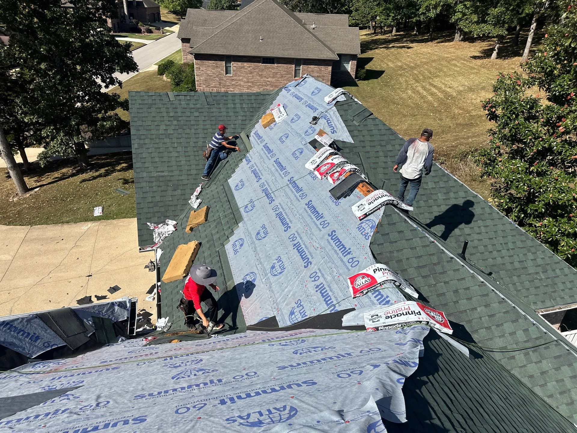 Residential Roofing Install - Green Atlas Pinnacle Pristine Shingles - White Gutters & Downspouts  by Titan Commercial & Residential Roofing 