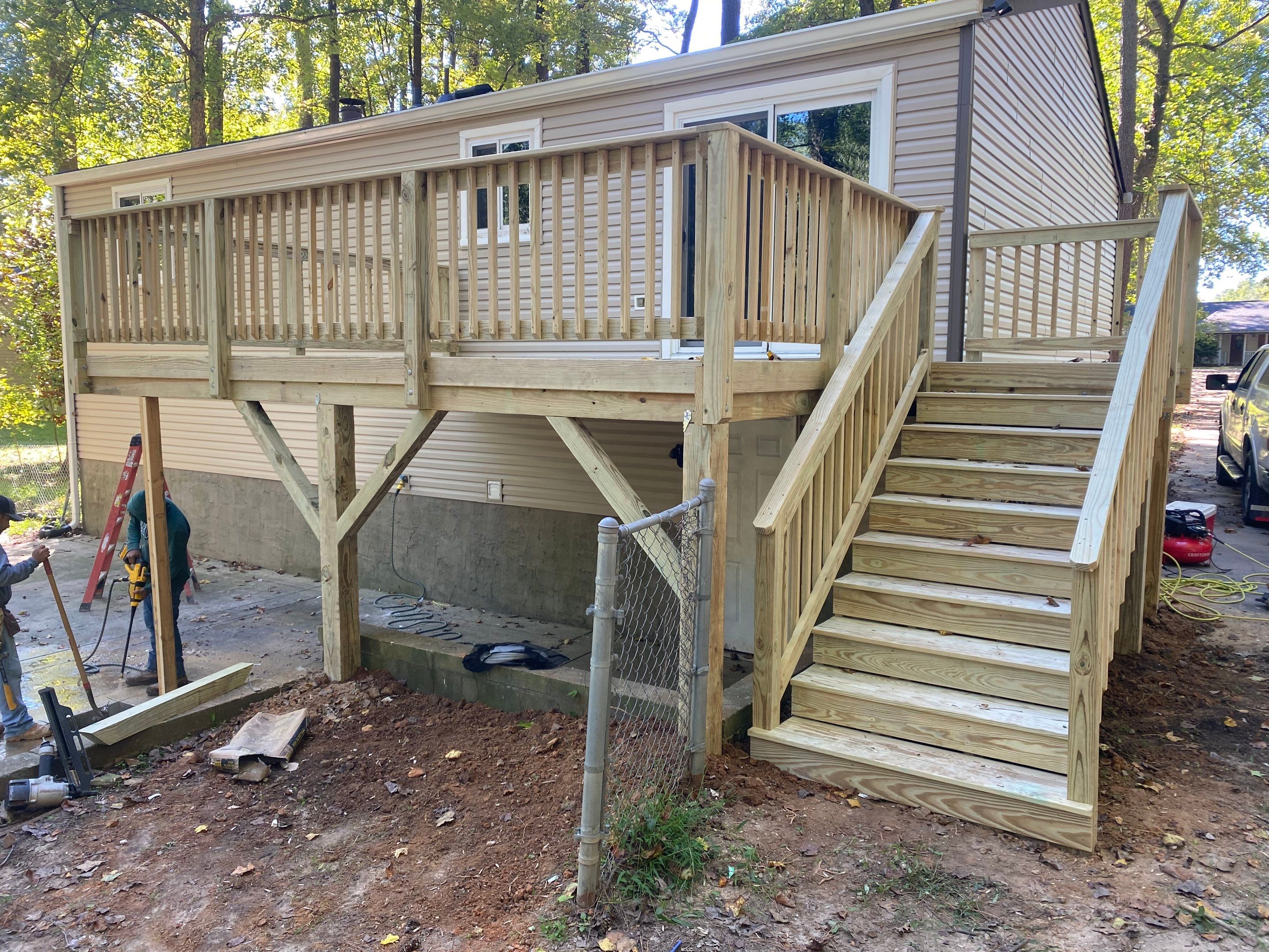 Custom Elevated Pressure-Treated Wood Deck Installation in Raleigh by The Remodeling Company