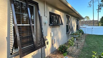 Hurricane Rated Bahama Shutters in Gray Brown