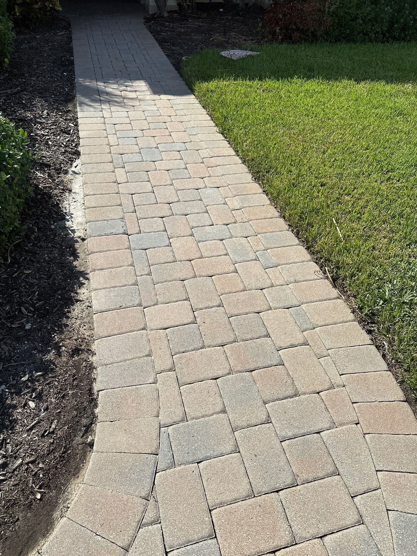 Paver Driveway, Entryway, Sidewalk, and Street Curbing Cleaning in Winding River Community, Bradenton, FL by Sunshine AquaWash