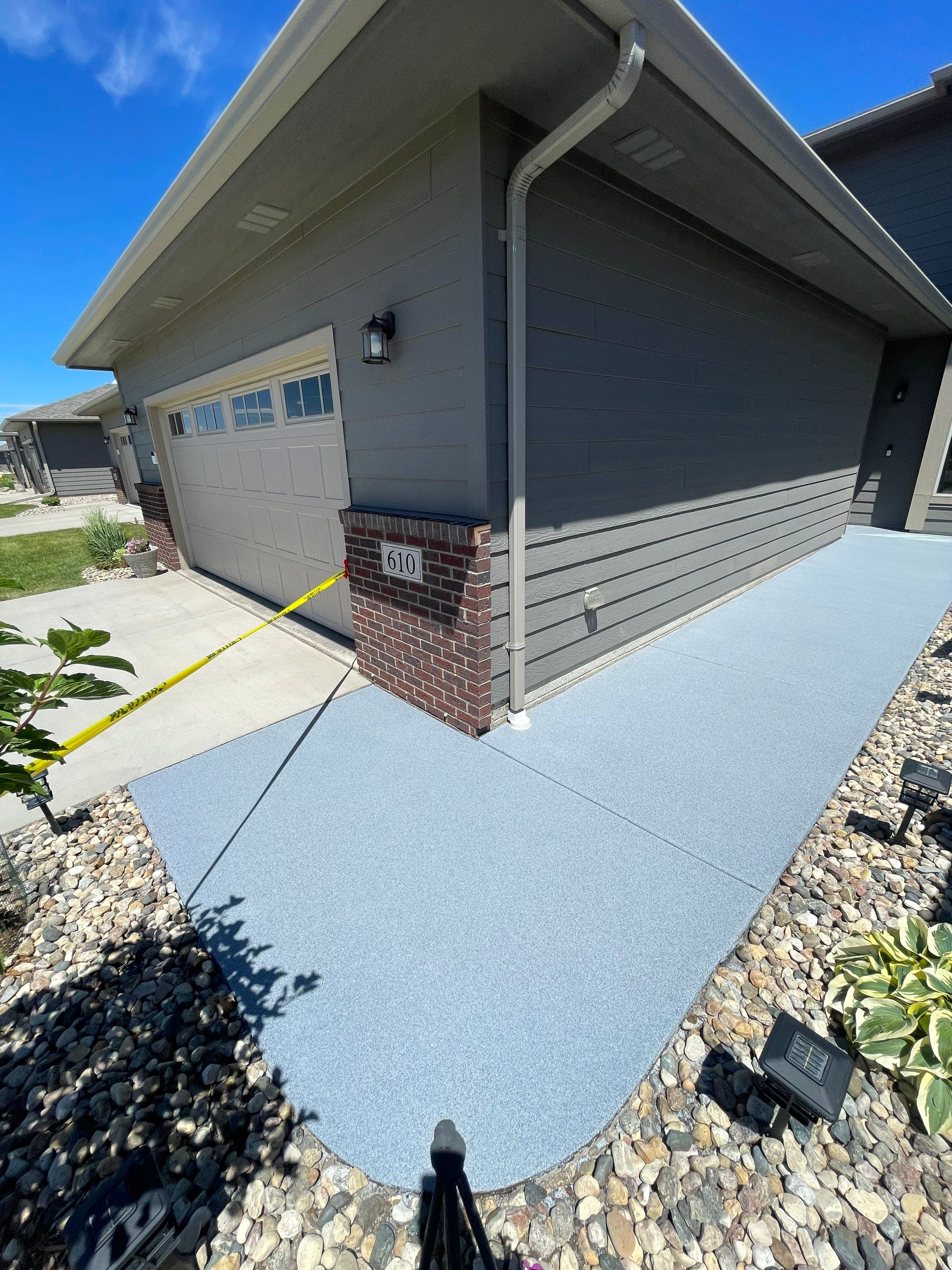 Custom Concrete Coating for Sioux Falls Patio and Front Walkway by Select Painting, Coatings & Garage Cabinets