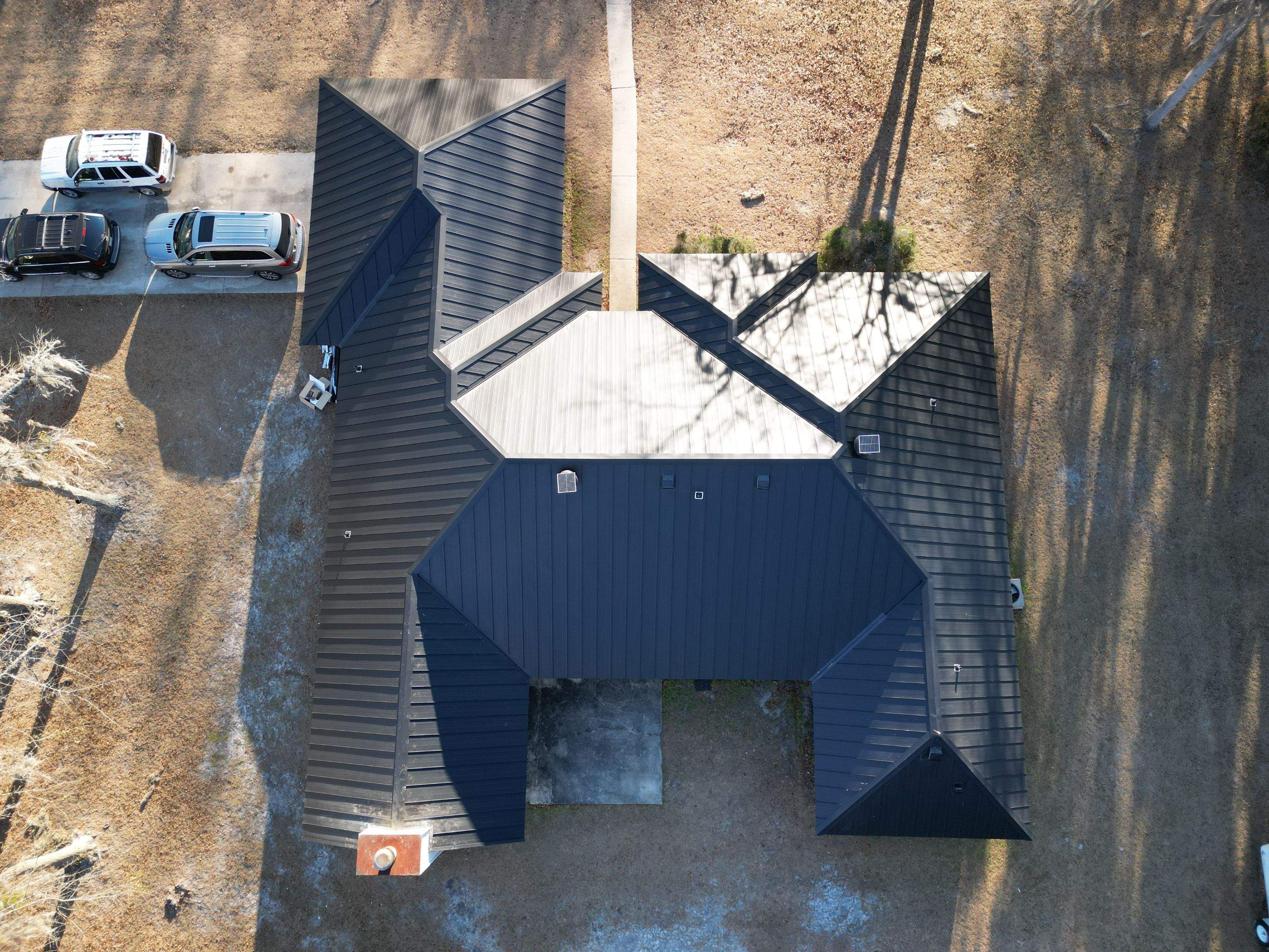 Residential Roofing Installation using Benton 26Ga 1inc Snapcock Metal Roof KYNAR Matte Black by Talya Roofing