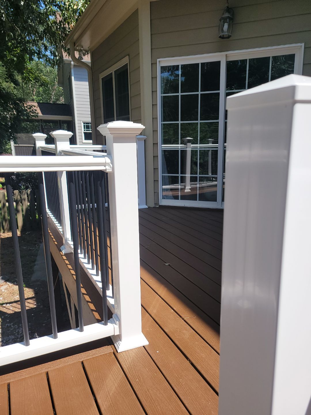 Fuquay-Varina Outdoor Upgrade – Composite Deck & Paved Landing by Elite Remodeling and Design LLC