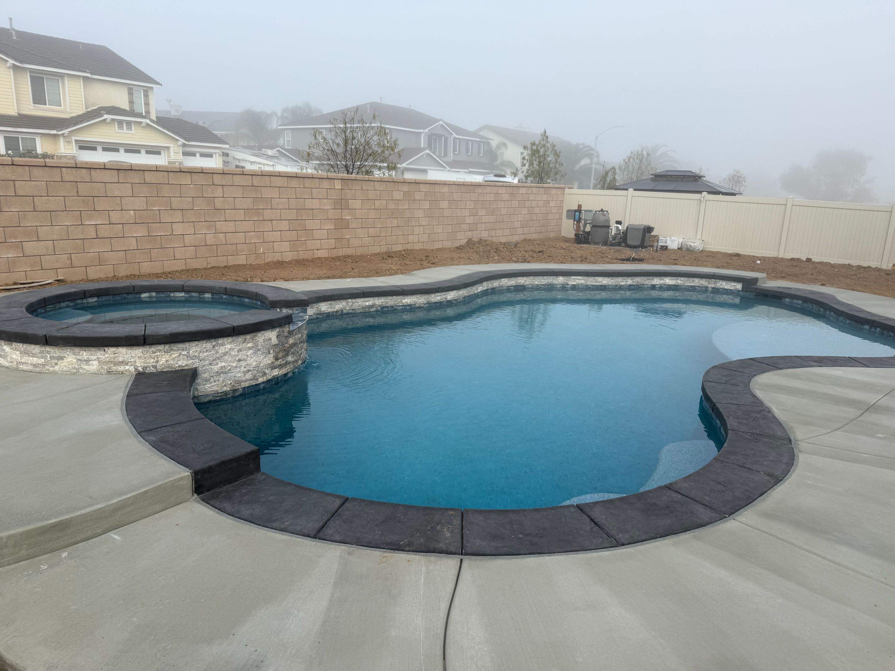 Freeform pool and spa pip coping by Premier Pools and Spas Temecula